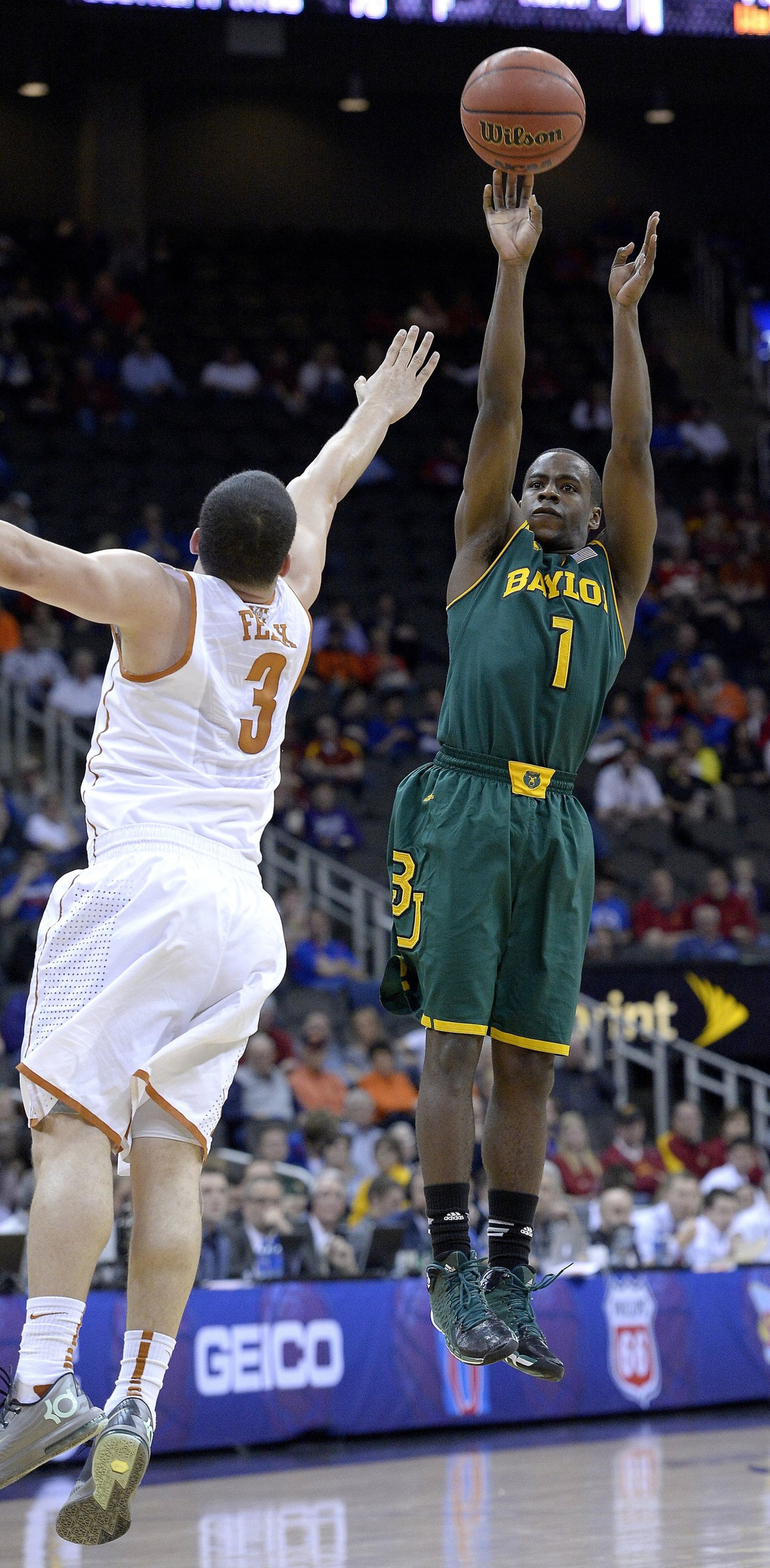 Baylor's Kenny Chery (1) takes a shot over Texas' Javan Felix (3) during the Big 12 Tournament semifinals at the Sprint Center in Kansas City, Mo., on Friday, March 14, 2014.
