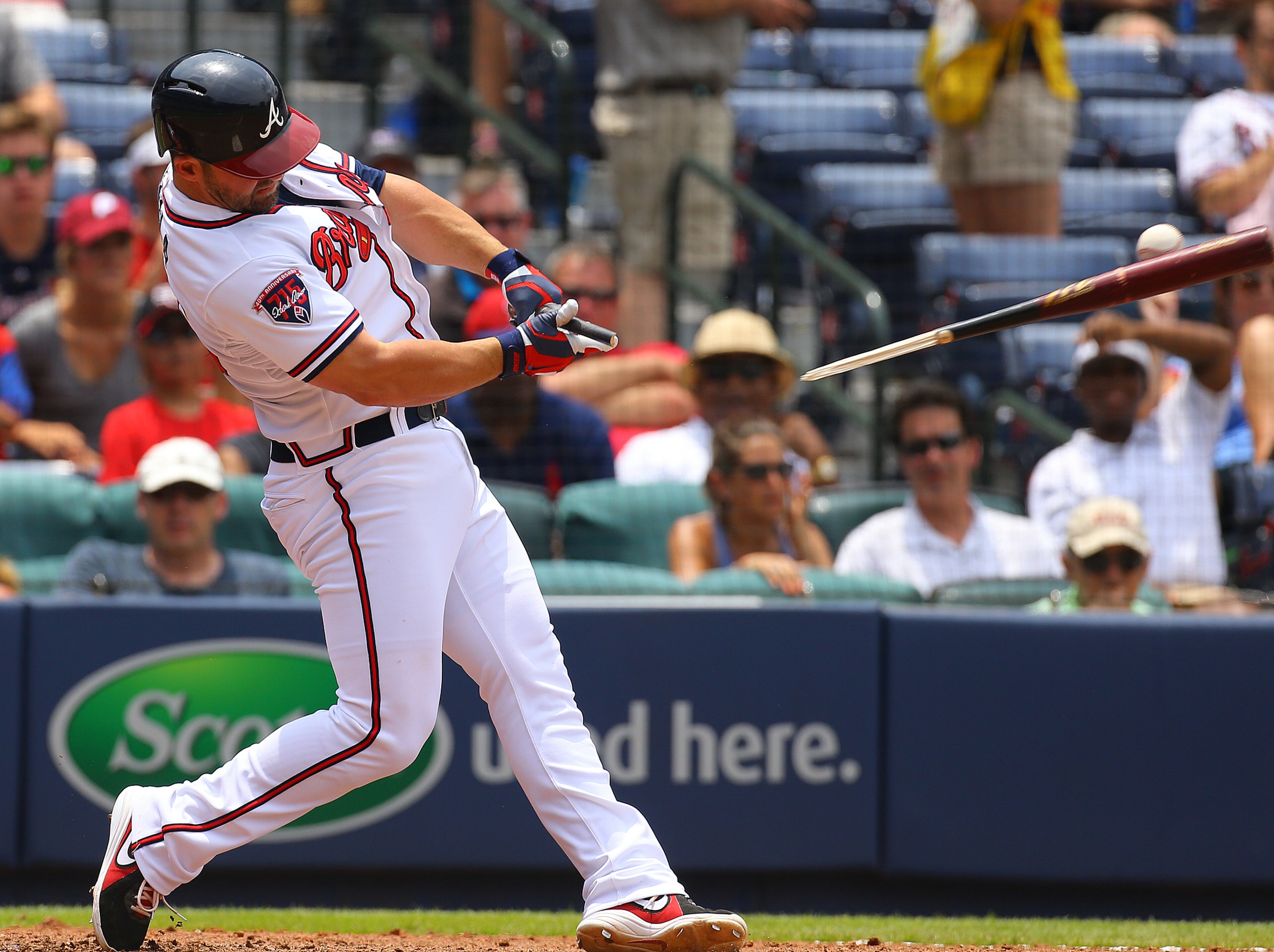 Braves pinch hitter Dan Uggla breaks his bat on a pitch by the Phillies during the sixth inning of an MLB game on Wednesday, June 18, 2014, in Atlanta. Uggla was hit by a pitch during the at bat and awarded first base. CURTIS COMPTON / CCOMPTON@AJC.COM