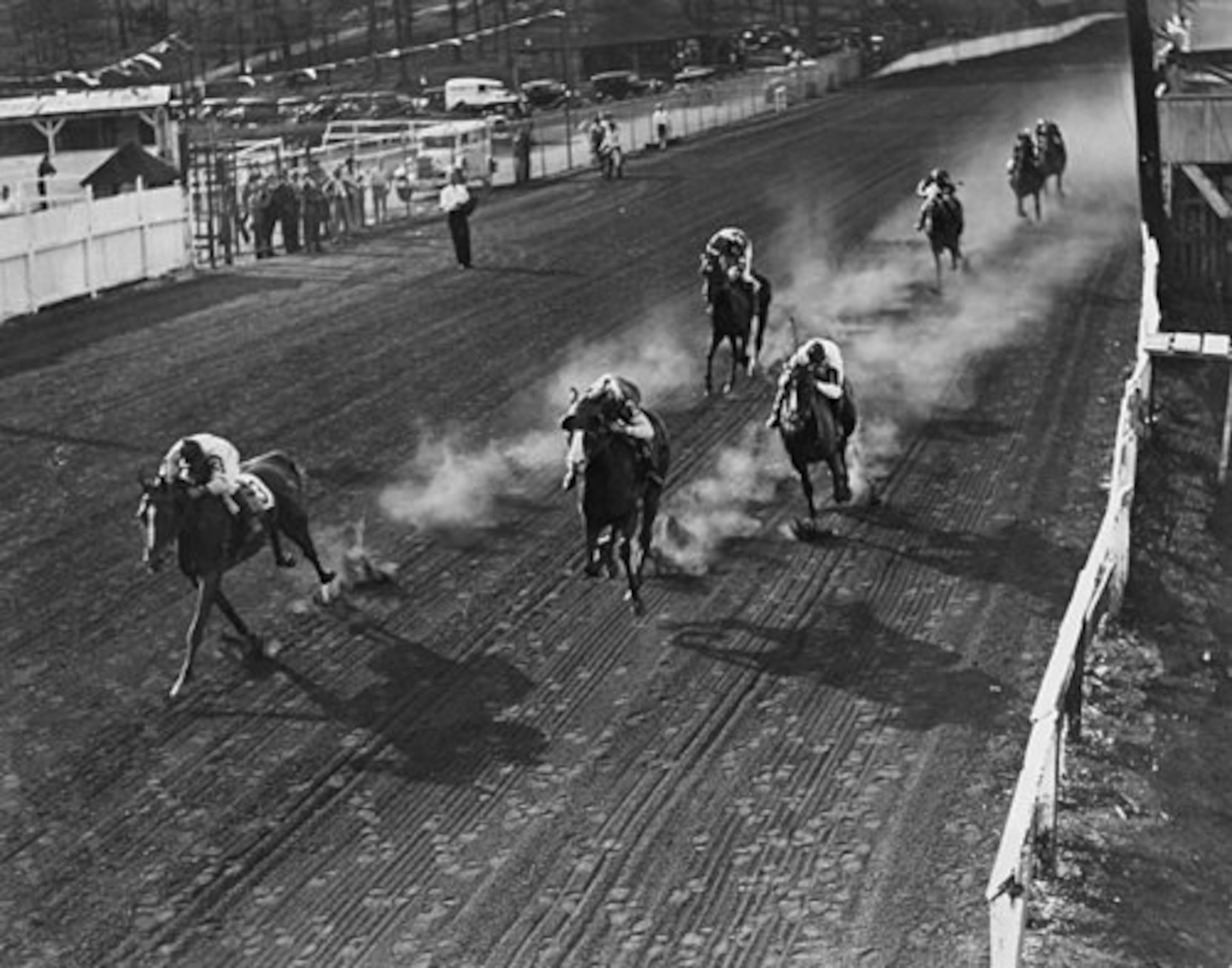 Horses gallop on the track at Lakewood Park in 1933.