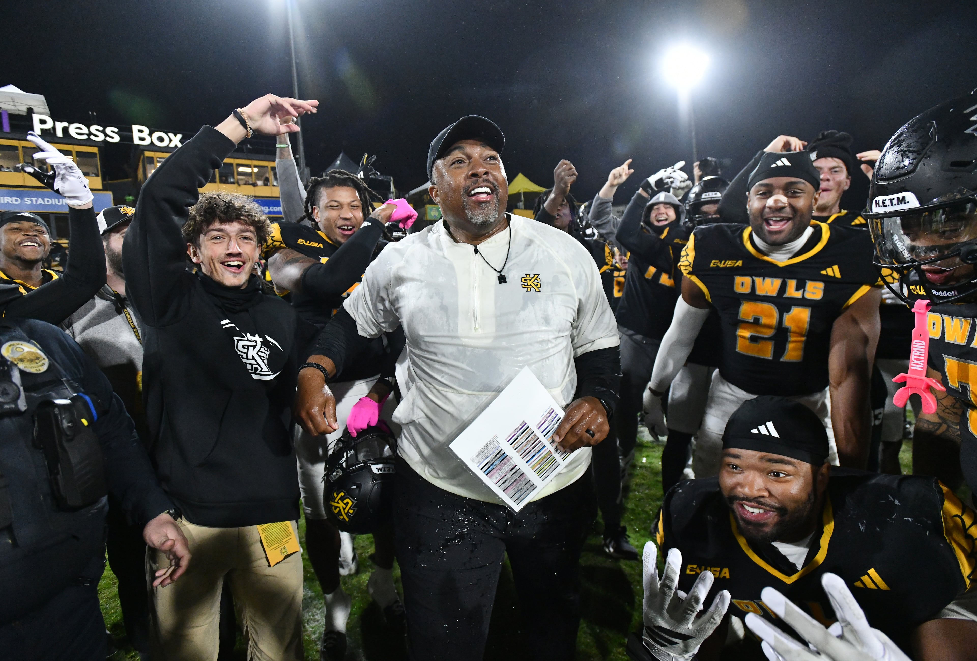 Kennesaw State head coach Jerry Mack celebrates with players after Kennesaw State beat UTEP during an NCAA college football game at Fifth Third Stadium, Tuesday, October 28, 2025 in Kennesaw. Kennesaw State won 33-20 over University of Texas at El Paso. (Hyosub Shin / AJC)