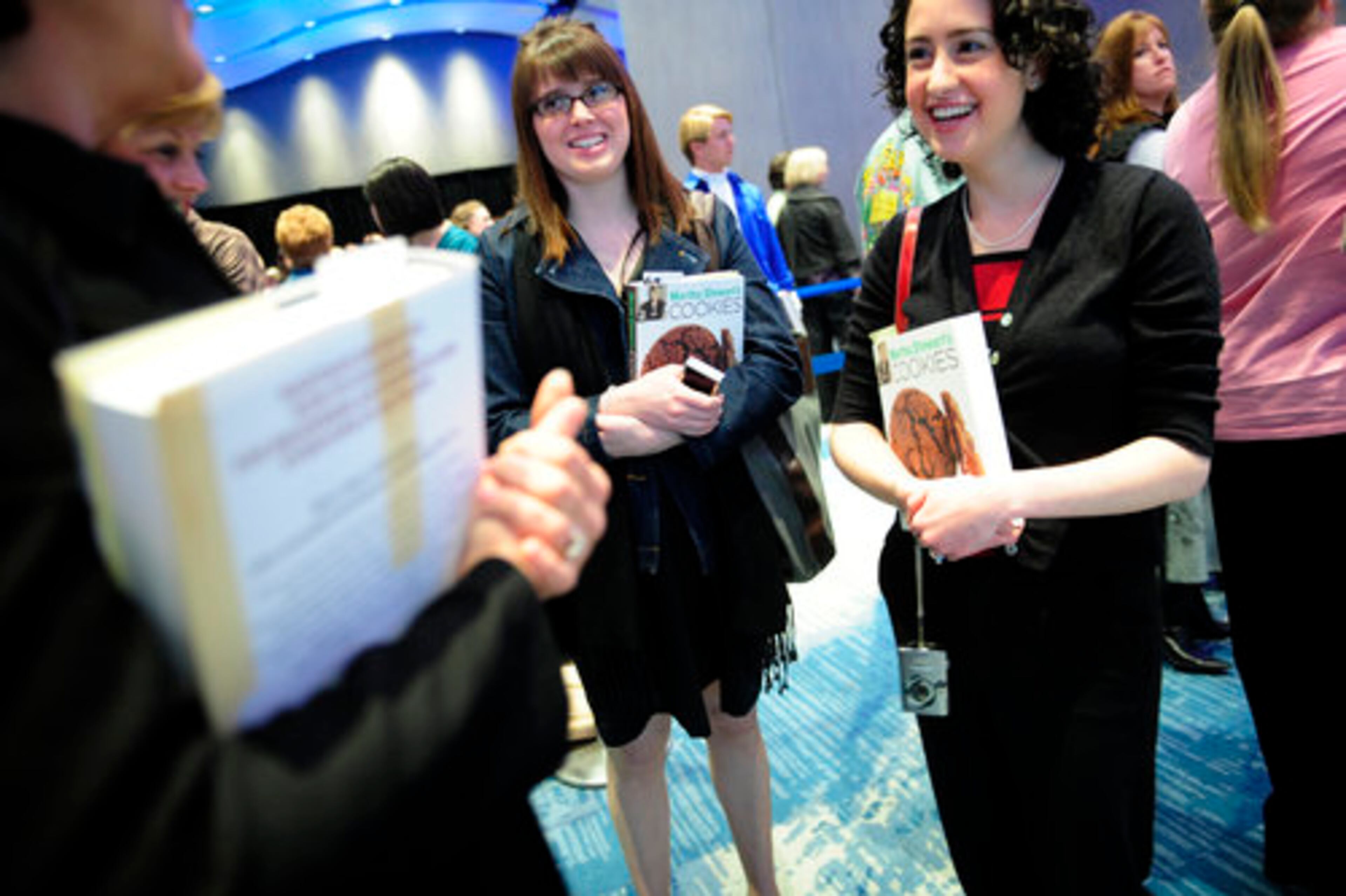 Beth Compton (left), 21, of Flowery Branch and Kelli Willard, 26, chat in line.