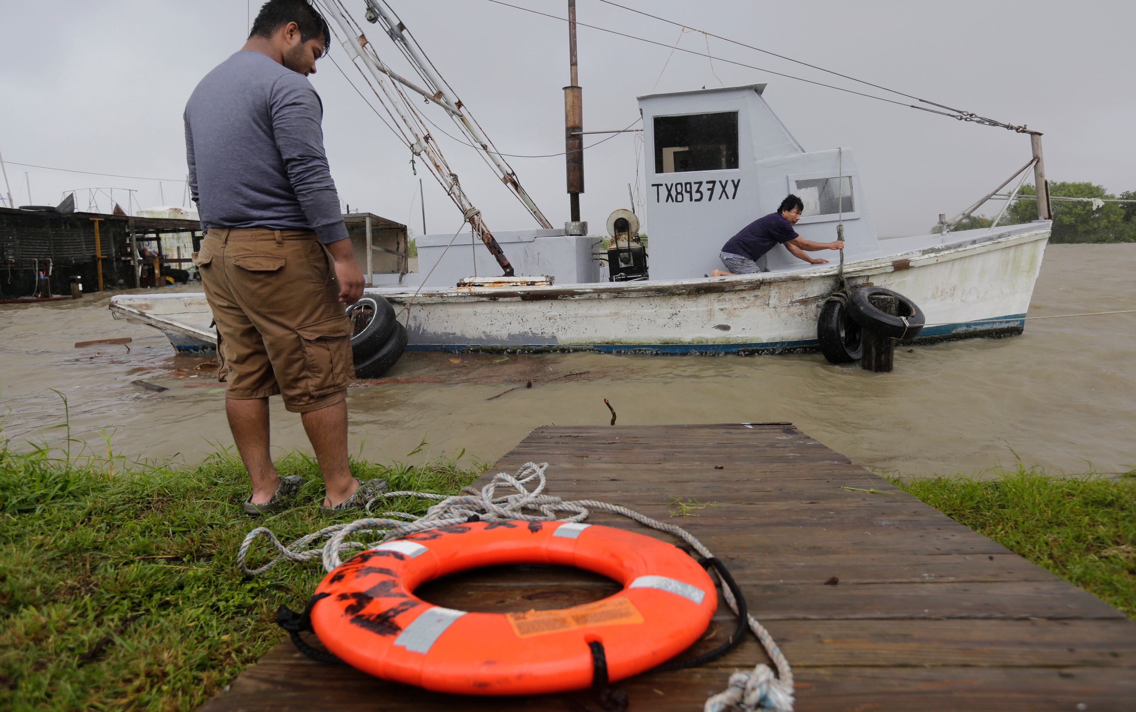 Oyster fishermen try to secure their boat as Tropical Storm Bill makes landfall, Tuesday, June 16, 2015, in Port Lavaca, Texas. (AP Photo/Eric Gay)