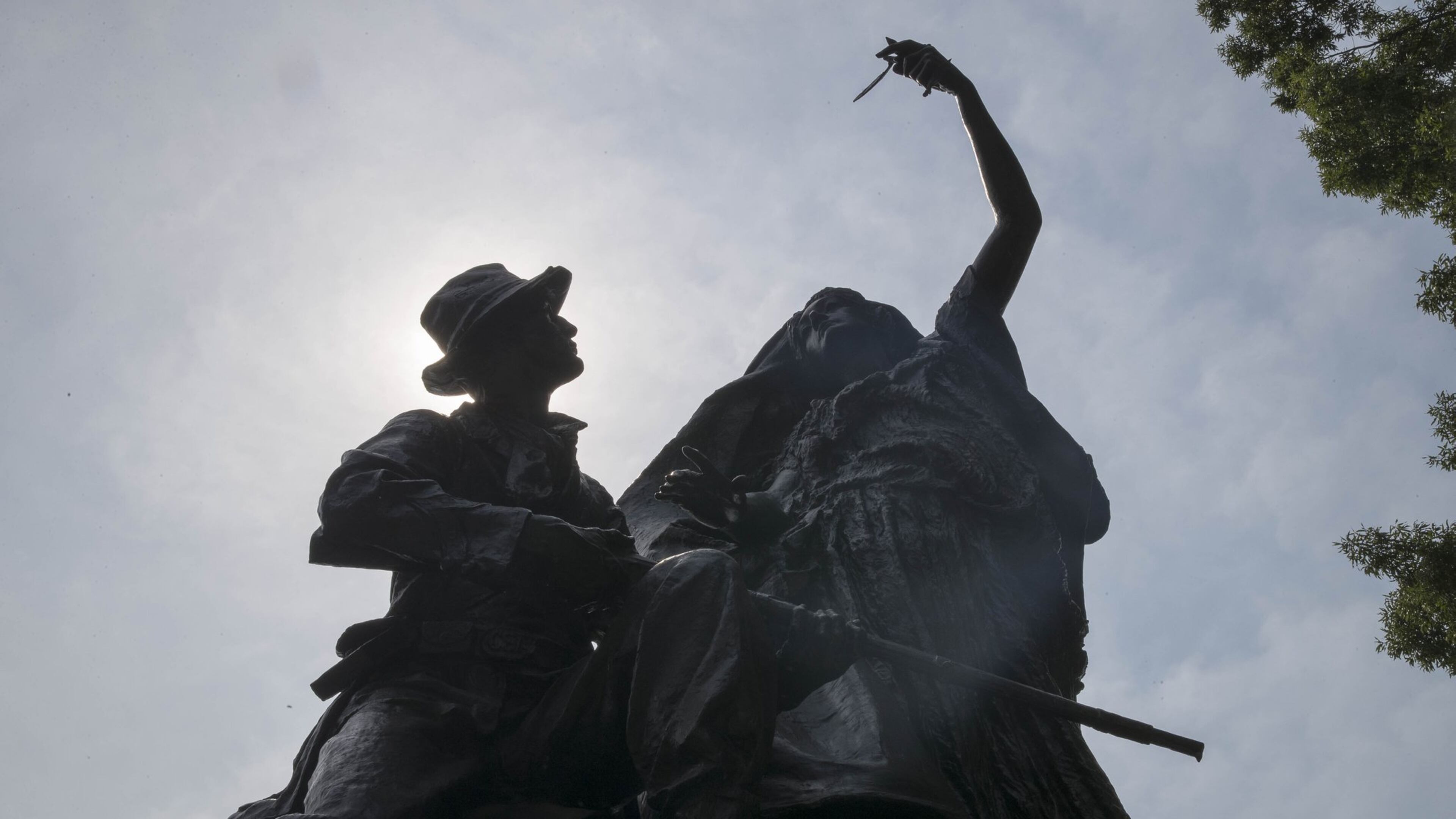The “Peace Monument” in Atlanta’s Piedmont Park depicts an angel staying the hand of a Confederate soldier as he holds a rifle. In her other hand, the angel holds an olive branch.