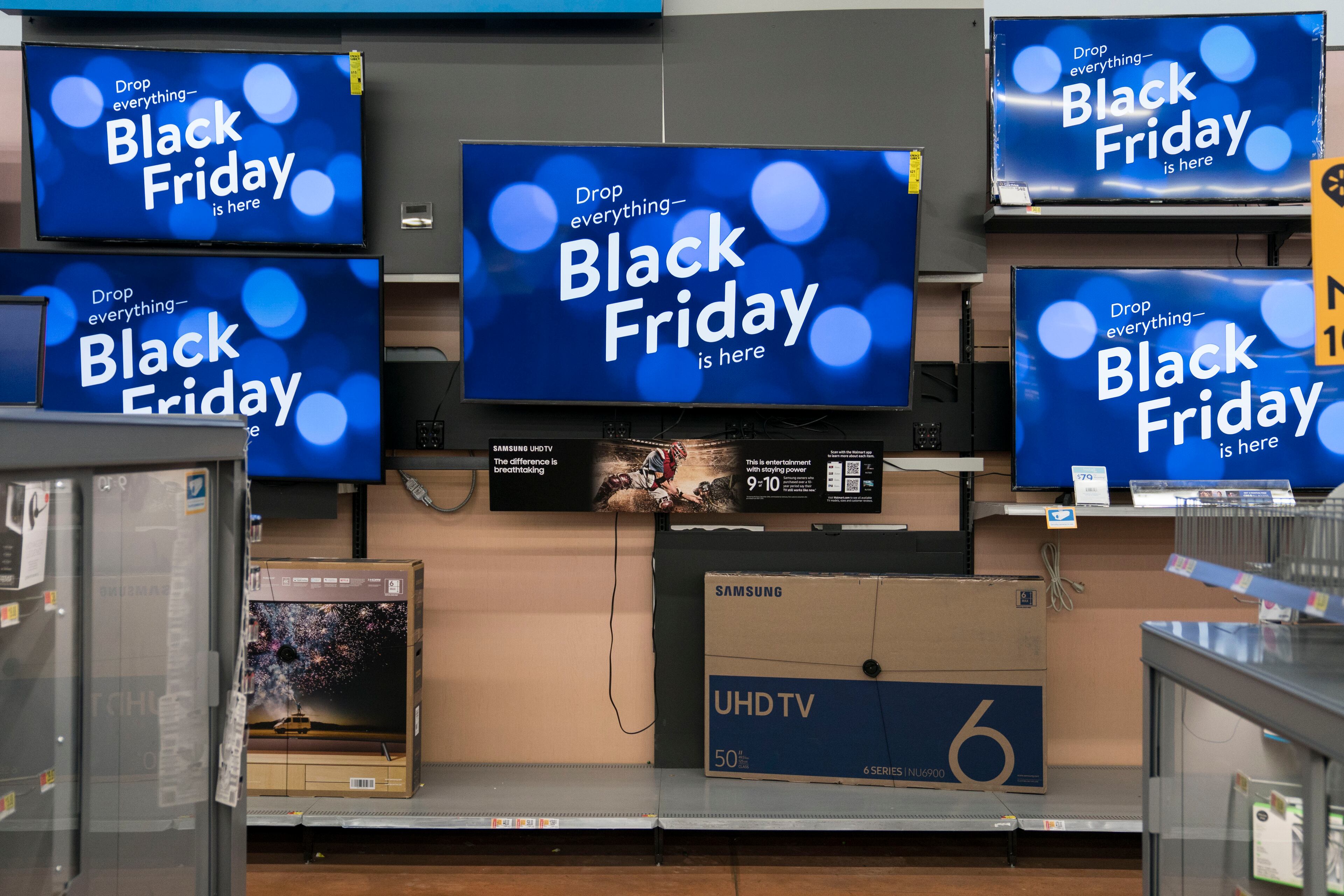 KING OF PRUSSIA, PA - NOVEMBER 28: Televisions display Black Friday ads in Walmart on Thanksgiving night on November 28, 2019 in King of Prussia, United States. (Photo by Sarah Silbiger/Getty Images)