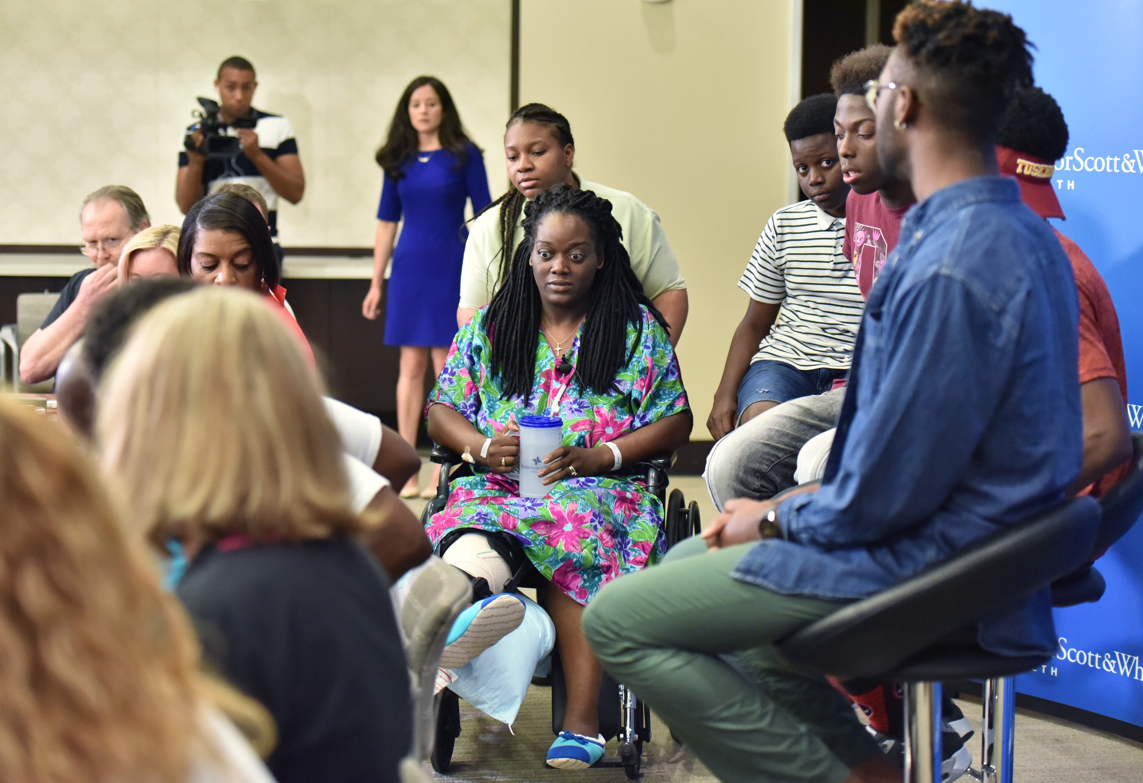 July 10, 2016 Dallas, Texas - Dallas shooting survivor Shetamia Taylor enters for a press conference at Baylor University Medical Center on Sunday, July 10, 2016. Shetamia Taylor, 37, risked her life to protect her 15-year-old son as chaos broke out in Dallas Thursday night when a sniper opened fire after an otherwise peaceful protest, killing five law enforcement officers. HYOSUB SHIN / HSHIN@AJC.COM