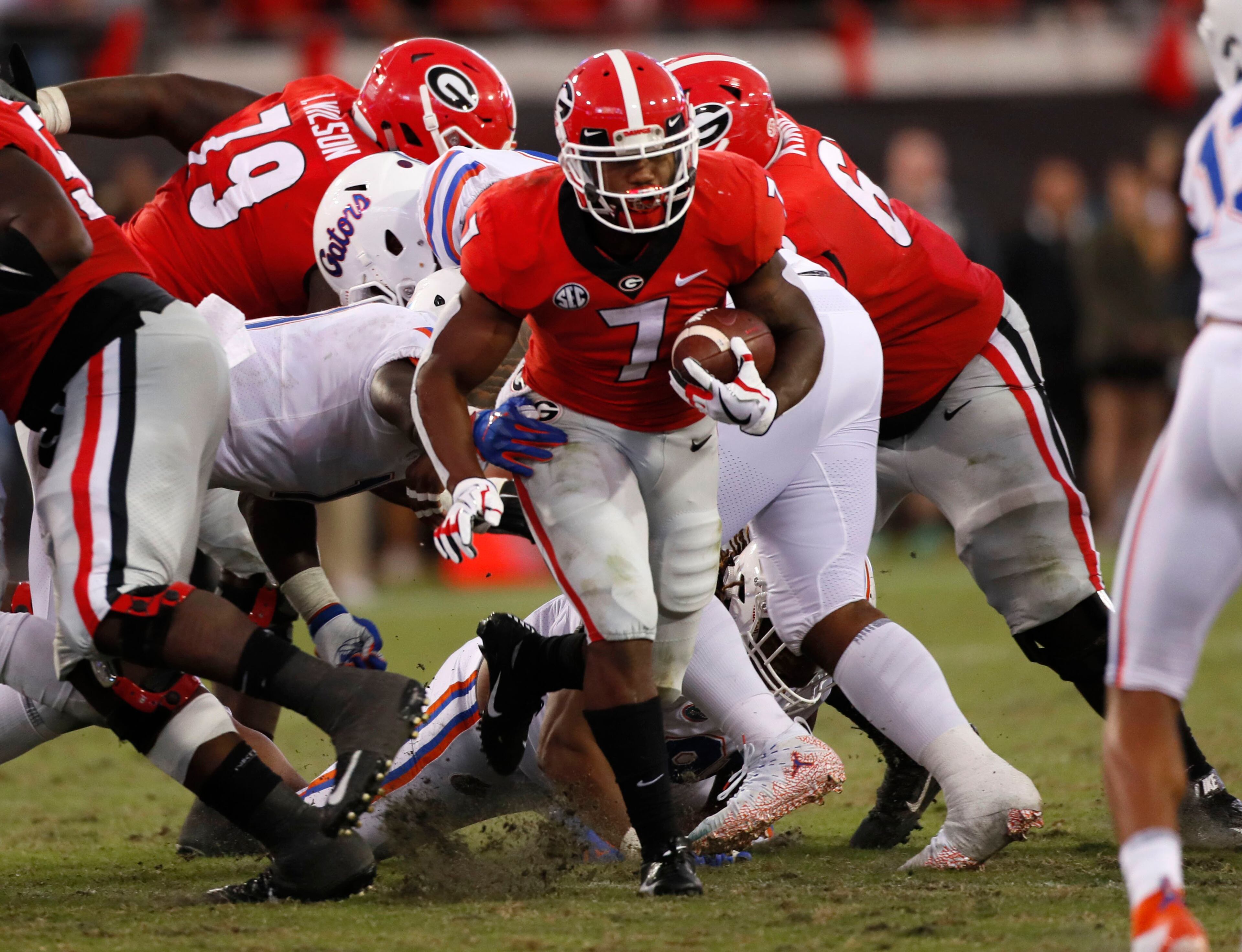 10/27/18 - Jacksonville - Georgia Bulldogs running back D'Andre Swift (7) breaks loose for a 30 plus yard run for a touchdown in the fourth quarter to cement the Bulldog victory. The University of Georgia Bulldogs beat the Florida Gators 36-17 in a NCAA college football game Saturday, Oct. 27th, 2018, at TIAA Bank Field in Jacksonville, FL. BOB ANDRES / BANDRES@AJC.COM