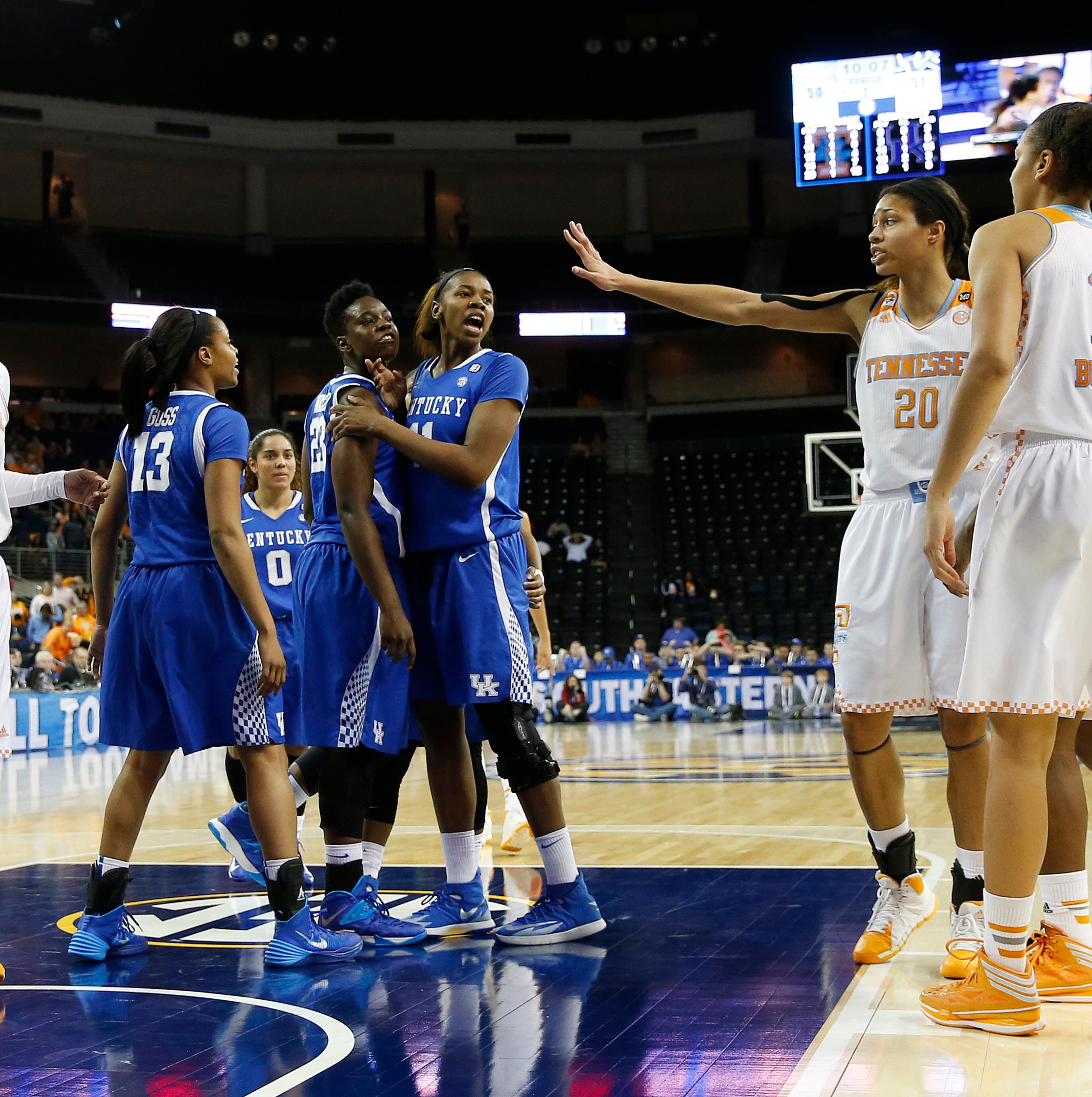 Kentucky forward/center Samarie Walker (23) and forward DeNesha Stallworth (11) exchange words with Tennessee center Isabelle Harrison (20) in the second half of an NCAA college basketball game in the finals of the Southeastern Conference women's tournament on Sunday, March 9, 2014, in Duluth, Ga. Tennessee won 71-70. (AP Photo/John Bazemore)