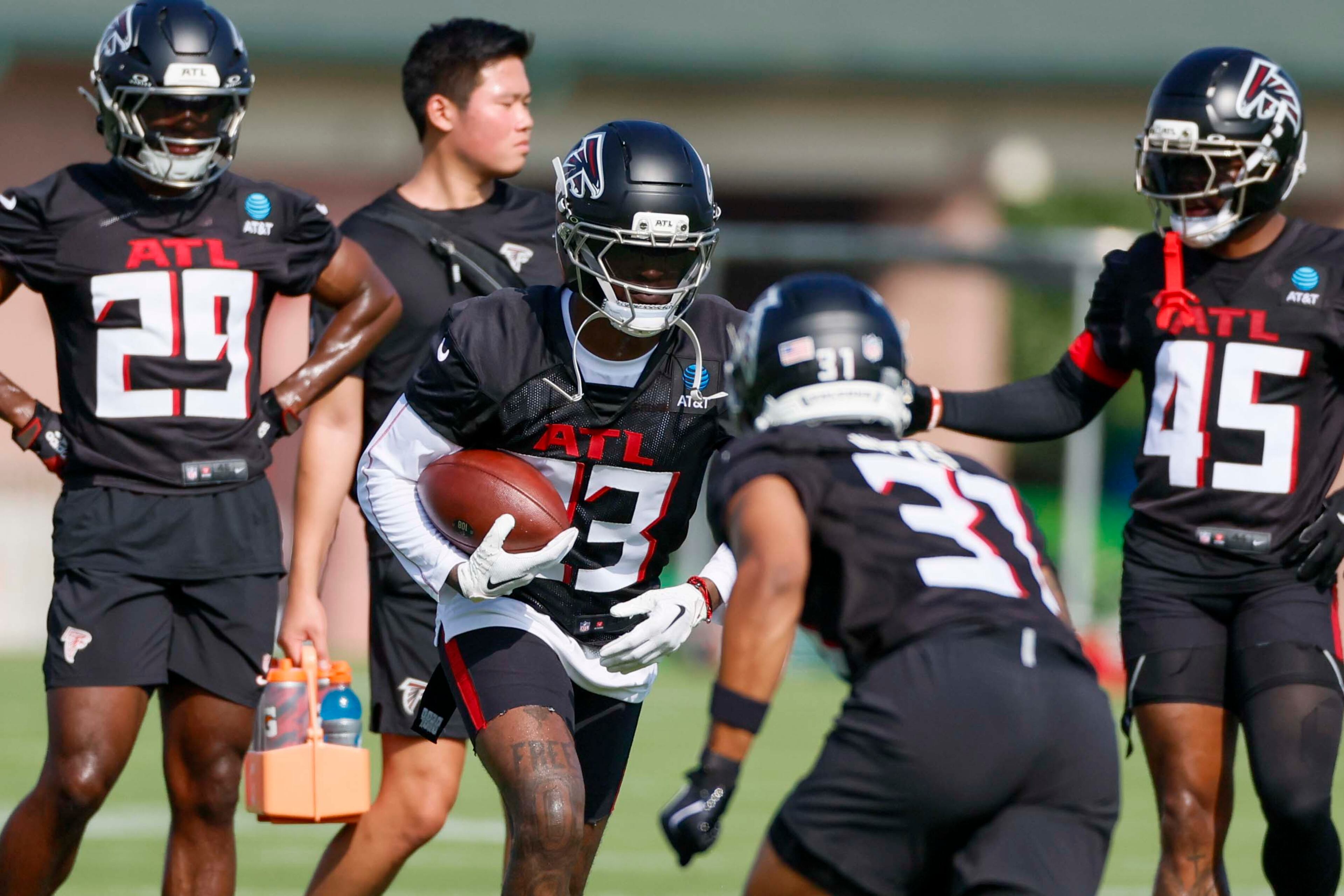 Atlanta Falcons safety DeMarcco Hellams, center, works on a drill during the first practice of training camp on Thursday, July 24, 2025, in Flowery Branch.
(Miguel Martinez/AJC)