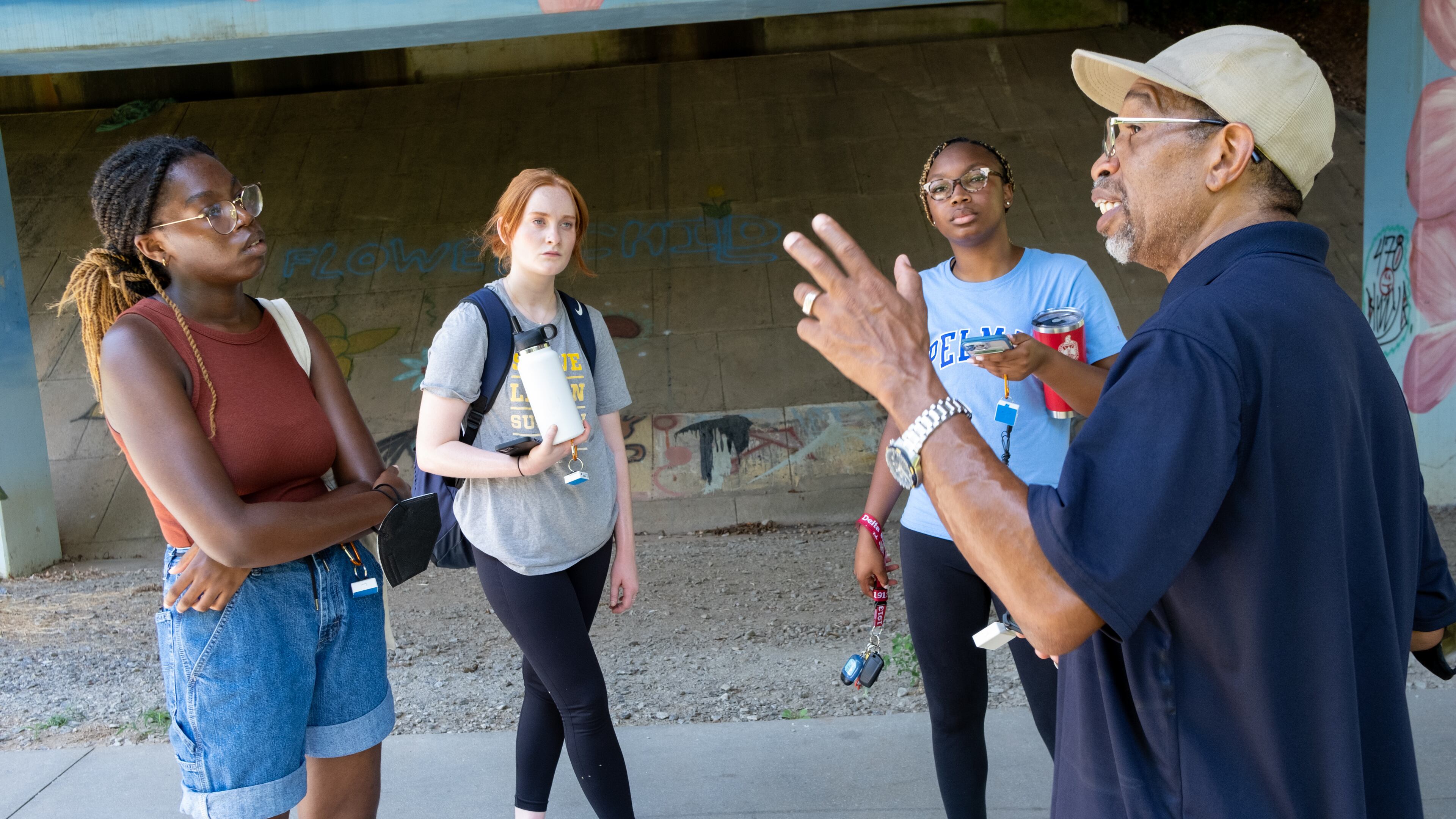 FILE: Georgia Tech students Zarya Ajasin, from left, and Meg Sanders and Spelman student Sommer Madison listen to Darryl Haddock, director of environmental education for the West Atlanta Watershed Alliance as they mapped temperatures along the Westside Beltline on Wednesday, June 15, 2022, for a research study. Ben Gray for the Atlanta Journal-Constitution