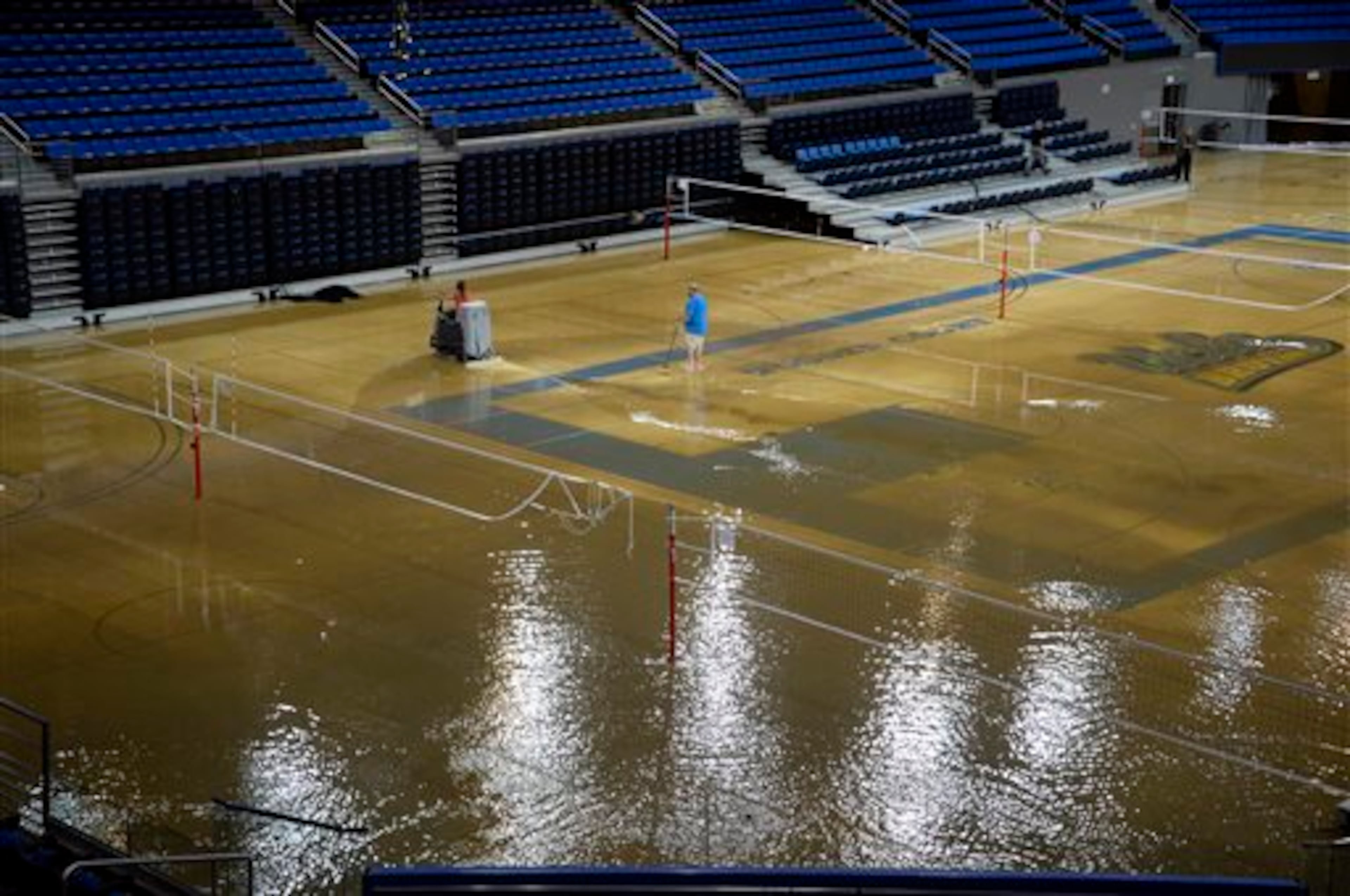 A broken water main near the UCLA campus Tuesday sent a geyser of water some 30 feet into the air, trapping people in underground parking garages and covering some of the best-known parts of campus in water, including the school's famed basketball arena.