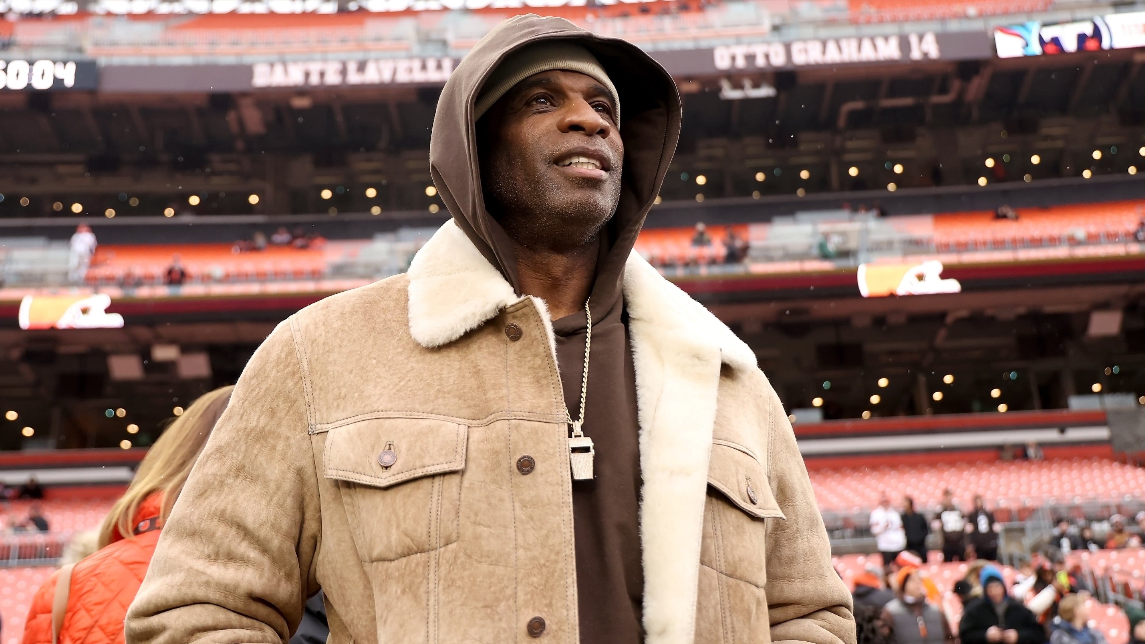 FILE - University of Colorado head coach Deion Sanders stands on the sidelines prior to the start of an NFL football game between the Cleveland Browns and the Tennessee Titans, Sunday, Dec. 7 2025, in Cleveland. (AP Photo/Kirk Irwin, File)