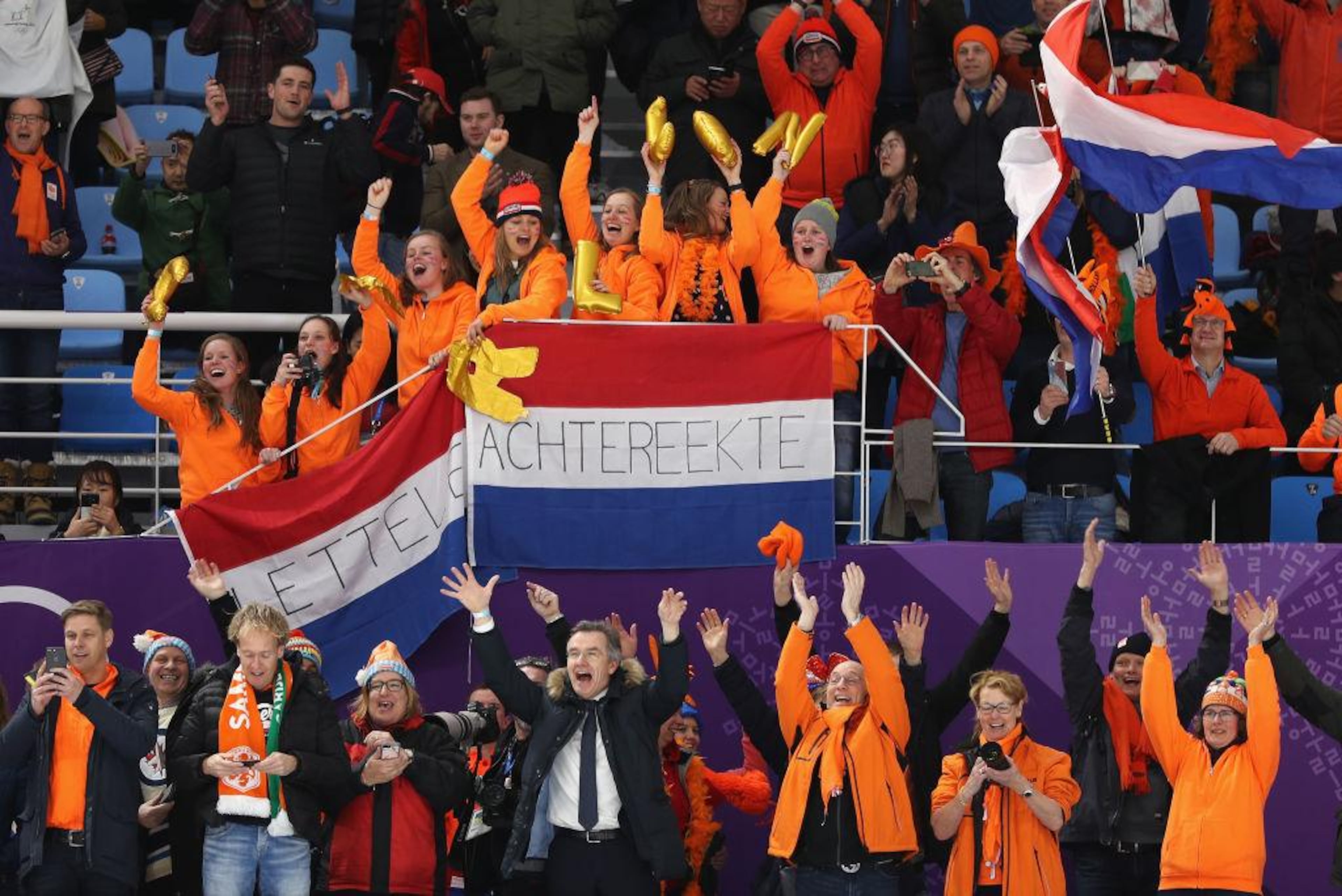 GANGNEUNG, SOUTH KOREA - FEBRUARY 10: Supporters cheer after silver medalist Ireen Wust of the Netherlands, gold medalist Carlijn Achtereekte of the Netherlands and bronze medalist Antoinette De Jong of the Netherlands sweep after the Women's Speed Skating 3000m on day one of the PyeongChang 2018 Winter Olympic Games at Gangneung Oval on February 10, 2018 in Gangneung, South Korea. (Photo by Maddie Meyer/Getty Images)