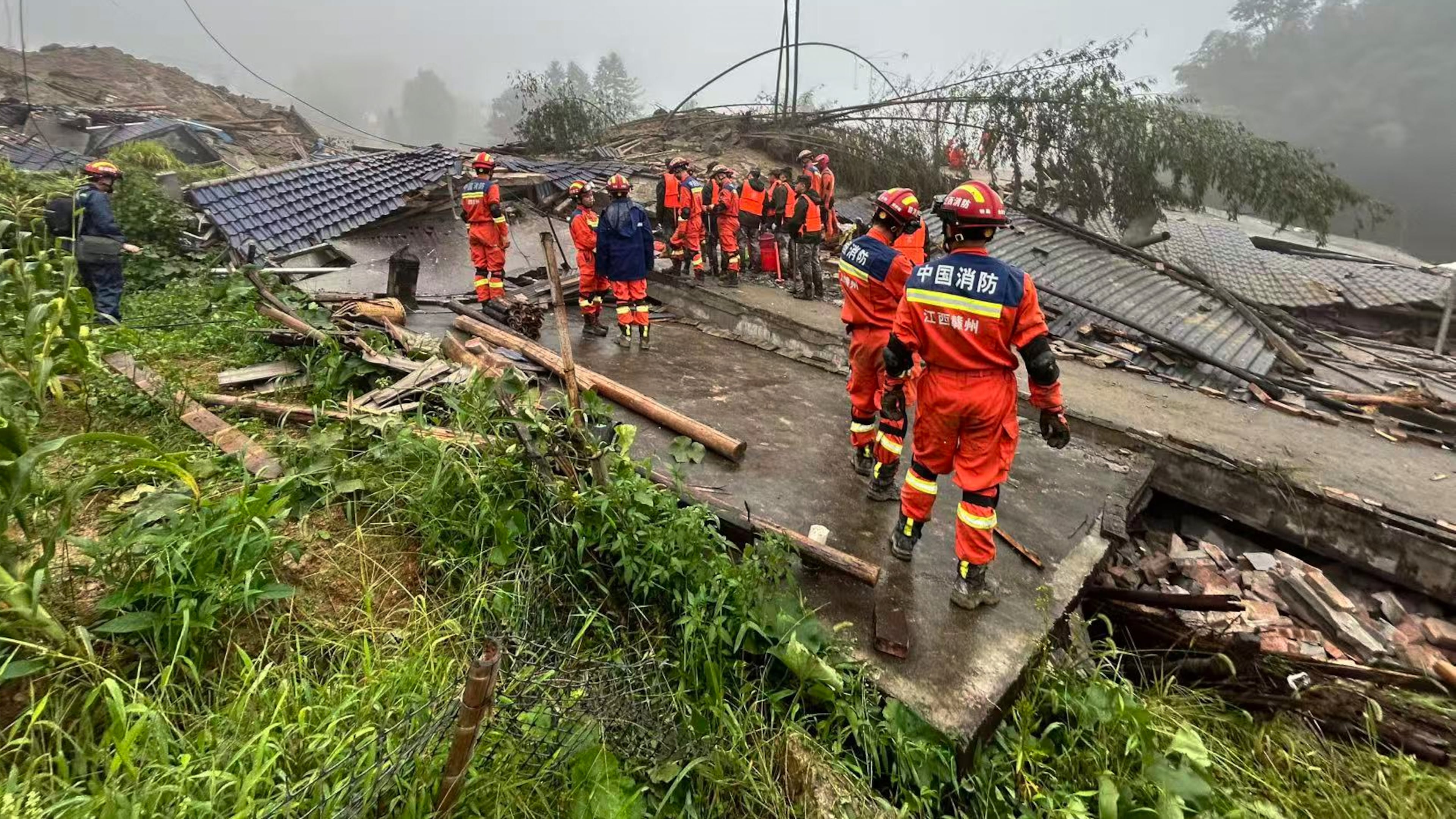 In this photo released by Xinhua News Agency, rescuers conduct a rescue operation at the site of a mudslide following days of heavy rain from tropical cyclone Saudel in Suichuan County of Ji'an City, east China's Jiangxi Province on Saturday, Sept. 5, 2026. (China Anneng Group Second Engineering Bureau Co., Ltd./Xinhua via AP)