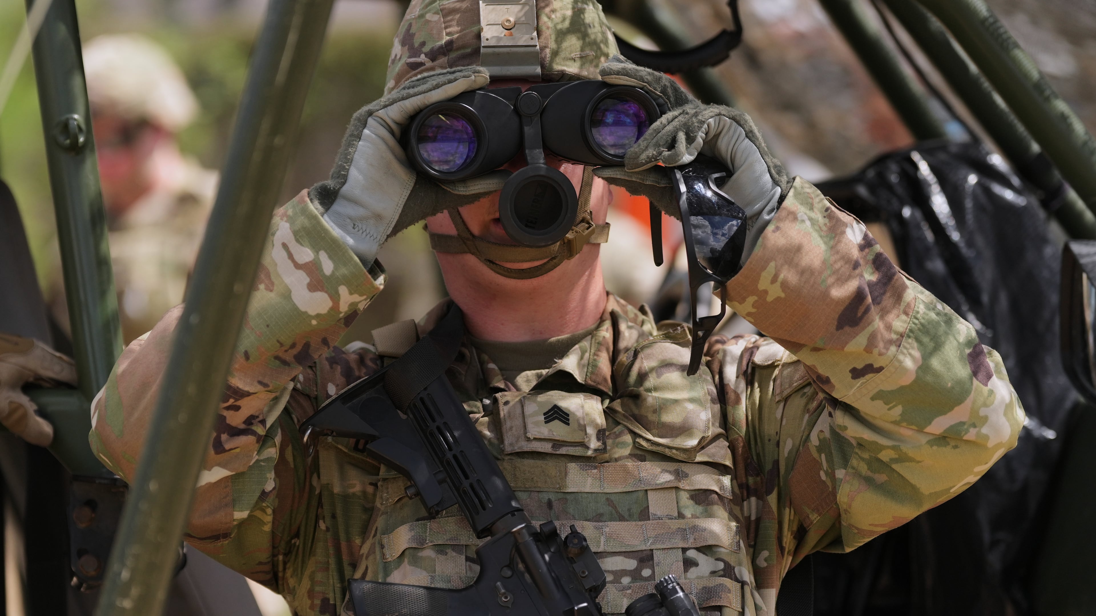 U.S. Army personnel keep watch over the U.S.-Mexico border in Roma, Texas, Thursday, Oct. 8, 2026. (AP Photo/Eric Gay)