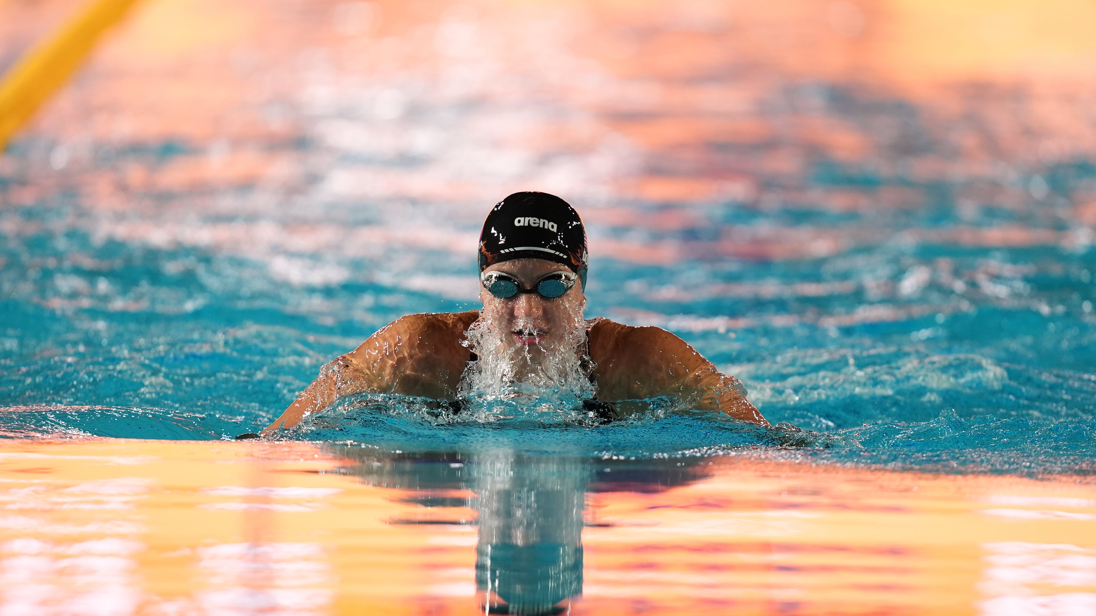 Kate Douglass, of the United States, competes in the women's 100 meters breaststroke final at the Pan Pacific Swimming Championships Thursday, Aug. 13, 2026 in Irvine, Calif. (AP Photo/Gregory Bull)