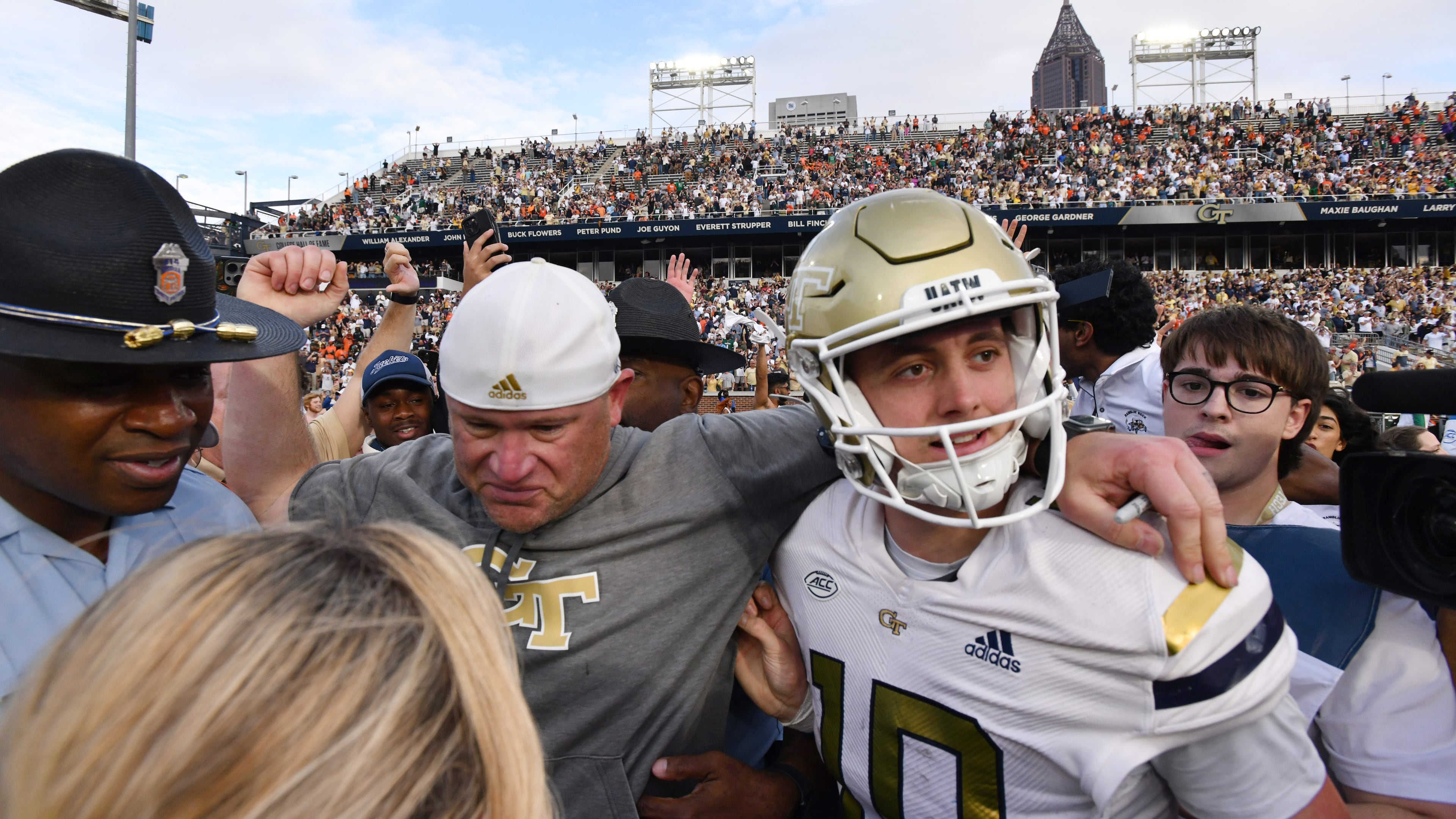 Georgia Tech coach Brent Key and quarterback Haynes King (10) celebrate after defeating Miami in an NCAA college football game at Georgia Tech's Bobby Dodd Stadium, Saturday, November 9, 2024, in Atlanta. Tech won 28-23 over Miami. (Hyosub Shin / AJC)