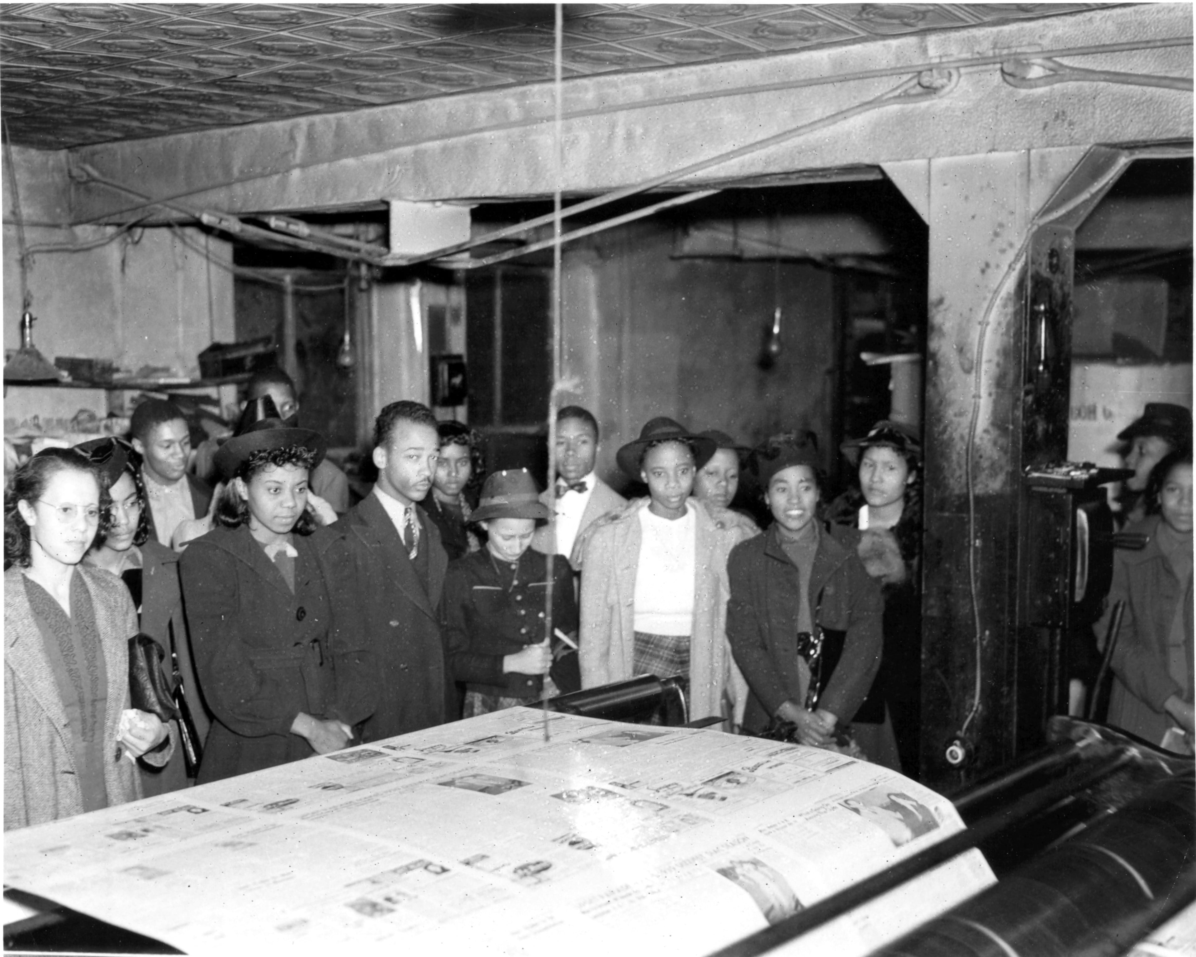 Undated 1940s photo of students touring Atlanta Daily World printing plant from Atlanta Daily World archives