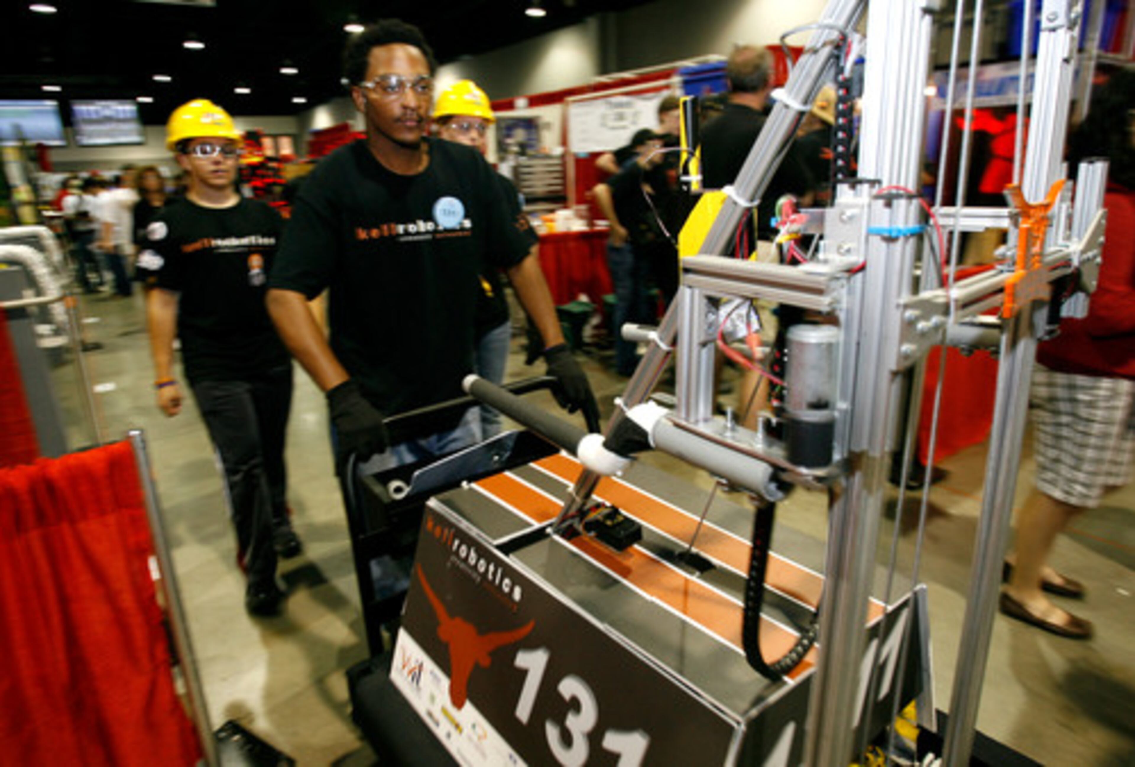Trey Chambers of Kell transports his team's robot from the pit area in the GWCC to the competition floor in the Georgia Dome.