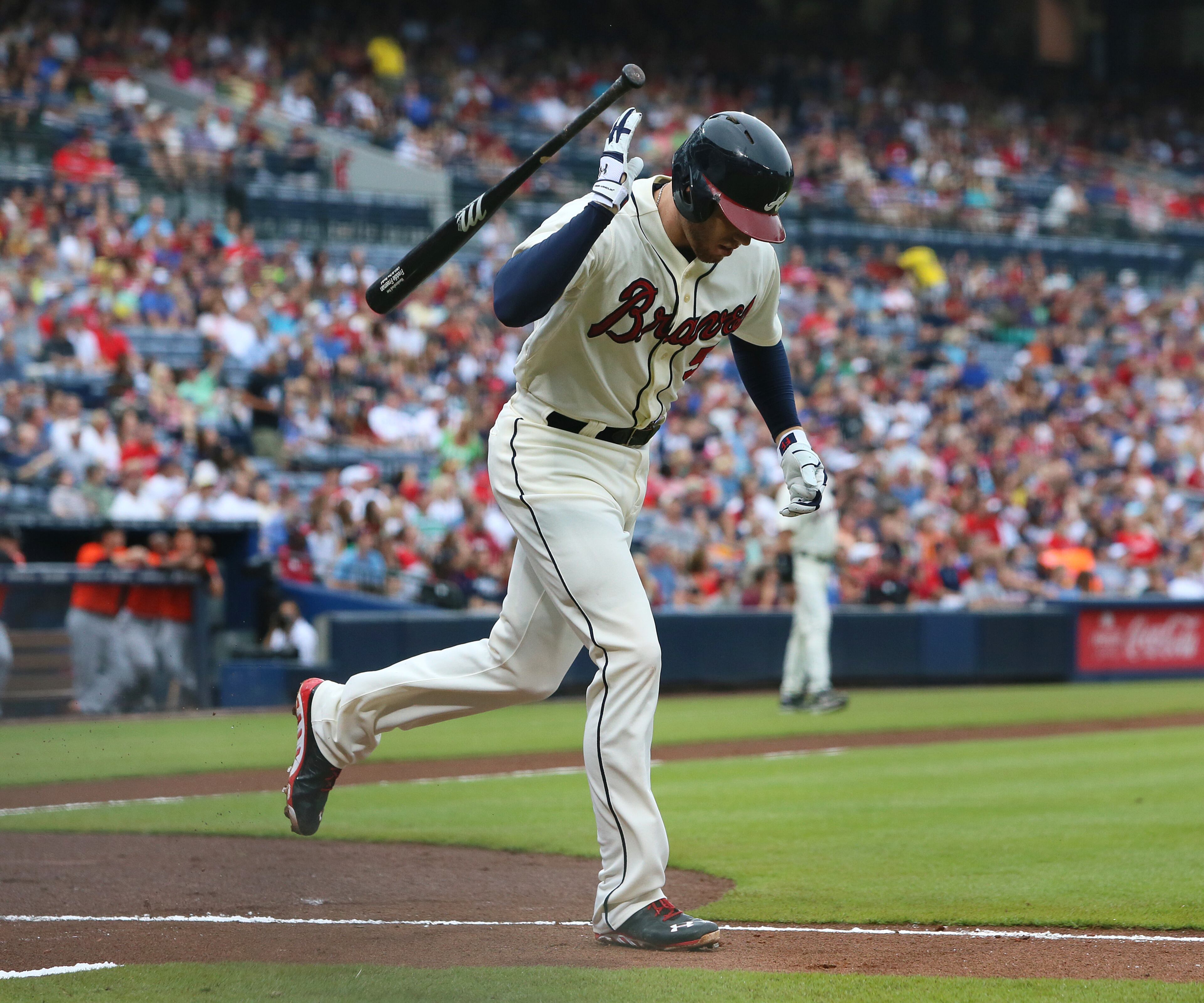 Braves Freddie Freeman tosses his bat over his shoulder flying out to the Marlins during the first inning of their MLB baseball game on Sunday, Sept. 1, 2013, in Atlanta.