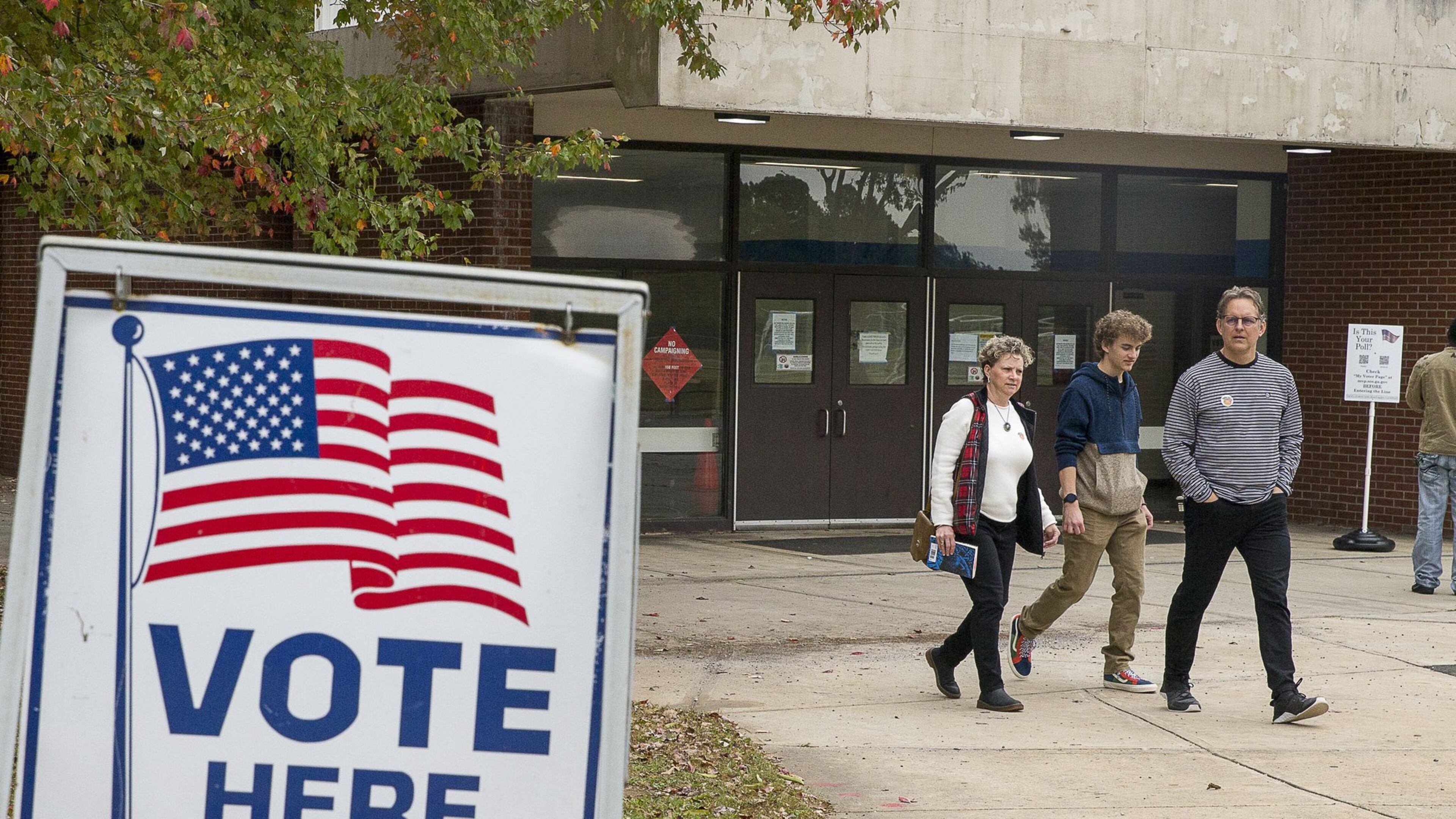 Jeff Brown (right), his wife Melony Brown (left) and their son Palmer Brown, leave Campbell Middle School after Jeff and Melony casted their ballots during Election Day in Smyrna, Tuesday, November 5, 2019. Both Jeff and Melony were able to cast their votes while Palmer, 18, who recently missed the registration date, was unable. Palmer plans on registering and voting in the upcoming 2020 elections. ALYSSA POINTER / APOINTER@AJC.COM