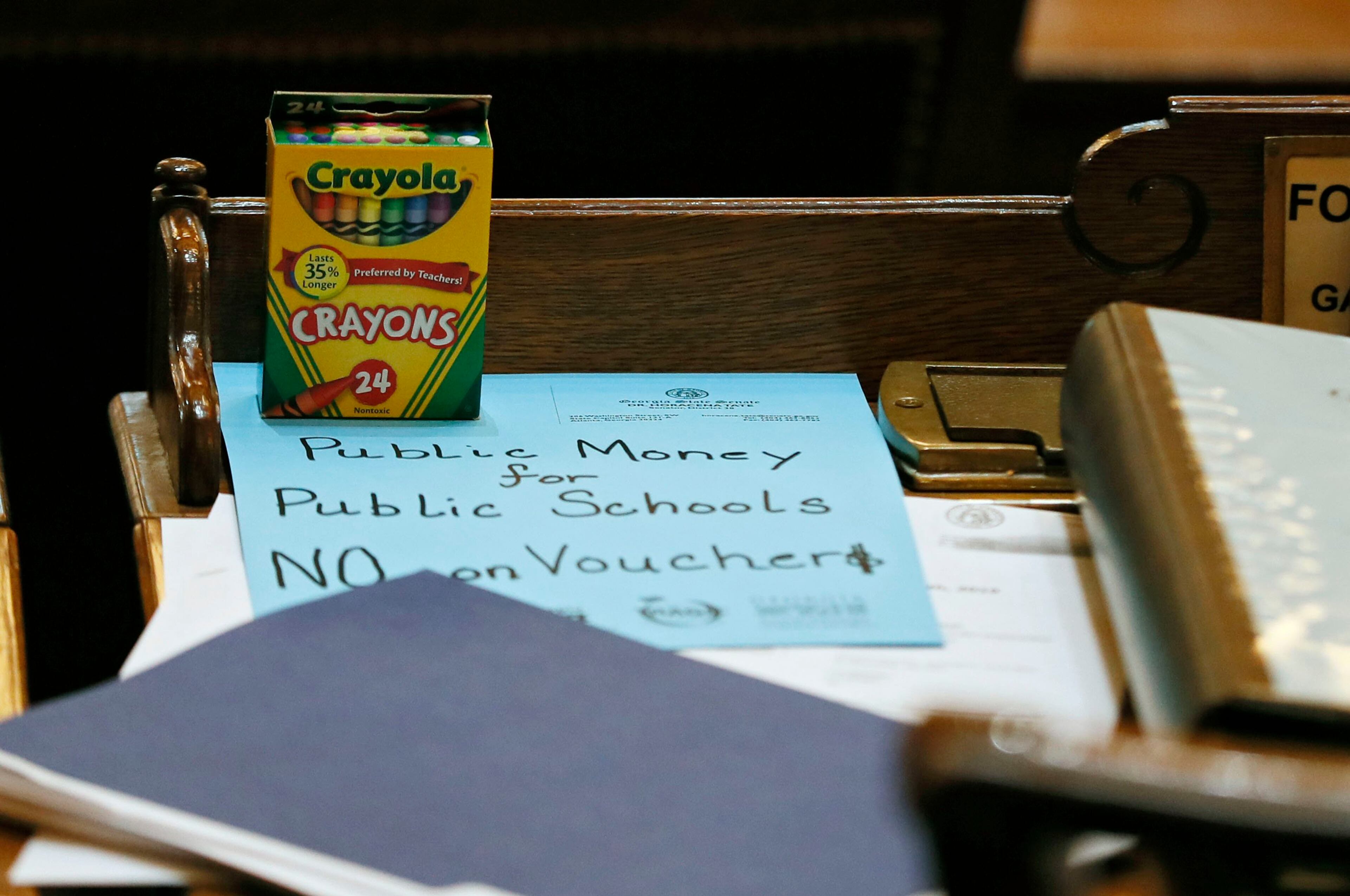 March 7, 2019 - Atlanta - The teacher lobby arranged to put anti-school-voucher props on every desk: boxes of crayons with a slogan scrawled on colored paper. The legislature was in session for "crossover" day, the 28th day of the 2019 General Assembly. Bob Andres / bandres@ajc.com