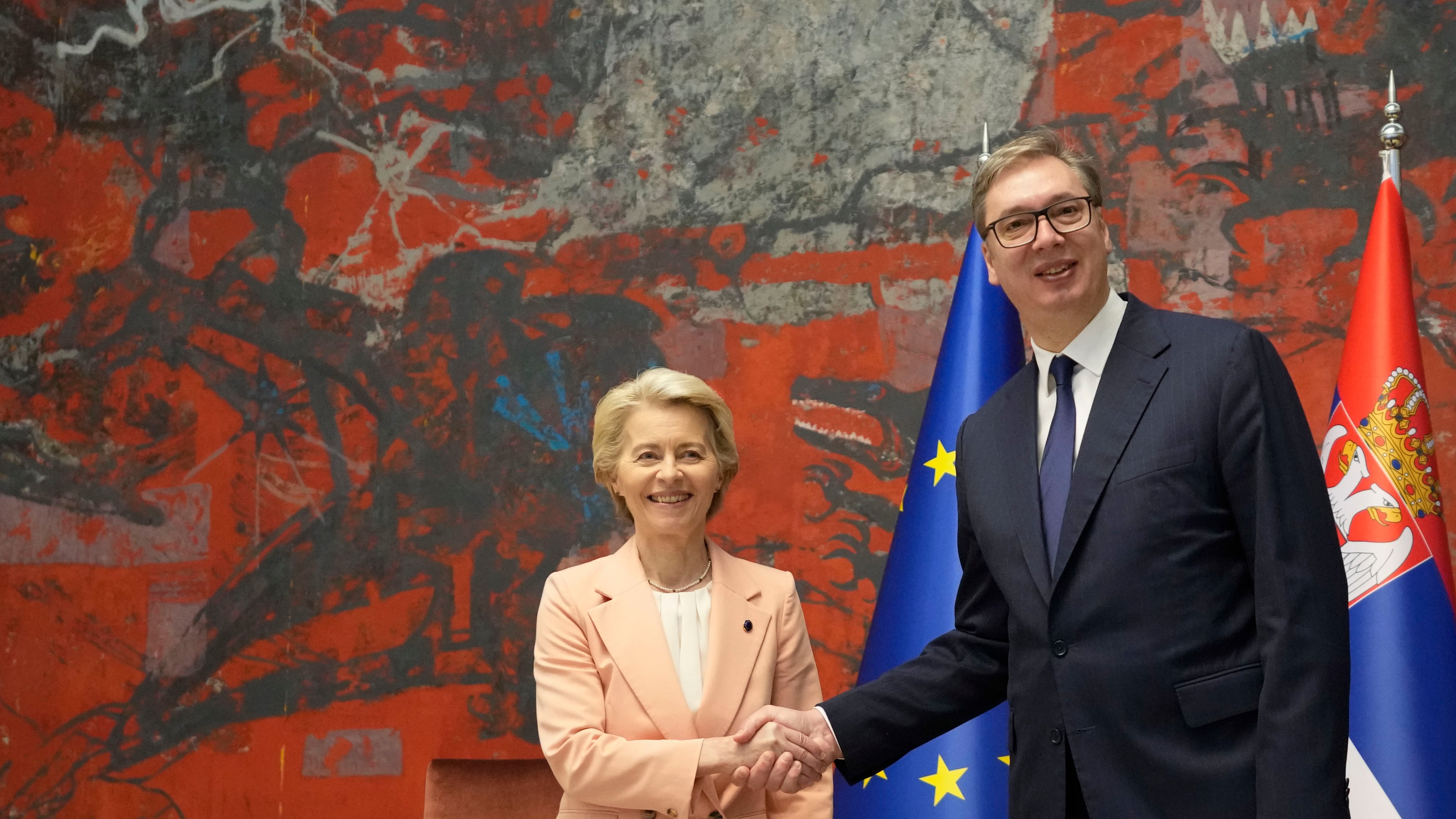 FILE - European Commission President Ursula von der Leyen, center, shakes hands with Serbian President Aleksandar Vucic in Belgrade, Serbia, on Oct. 25, 2024. (AP Photo/Darko Vojinovic, File)
