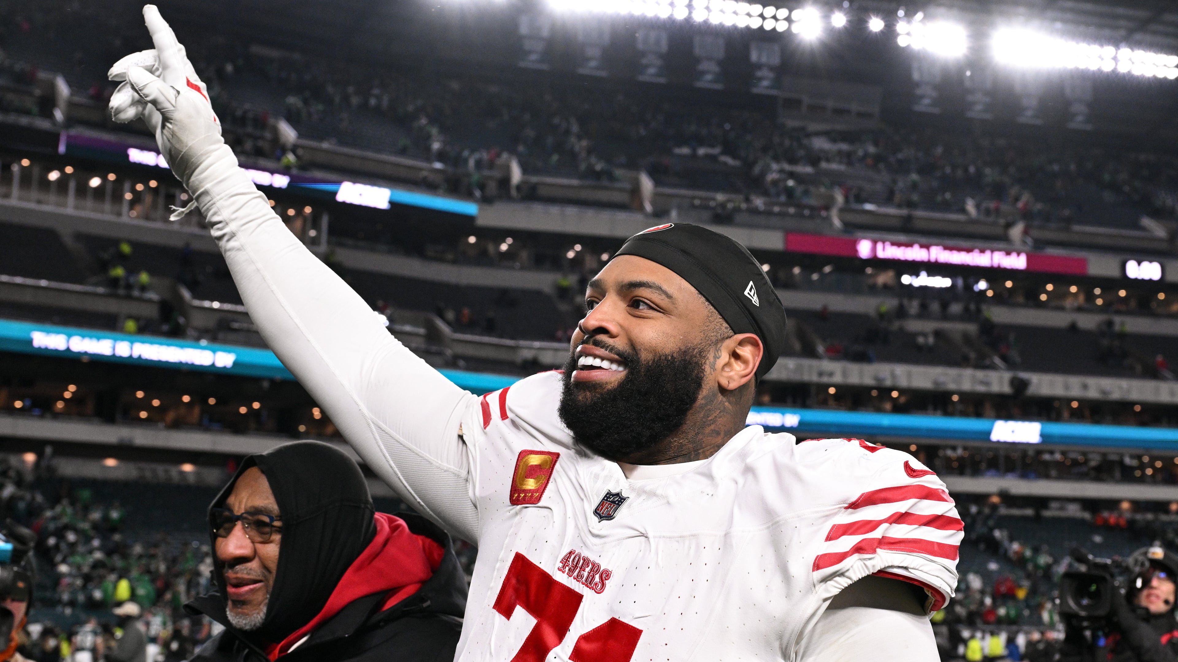 FILE - San Francisco 49ers offensive tackle Trent Williams (71) celebrates as he walks off the field after an NFL wild card playoff football game against the Philadelphia Eagles, Jan. 11, 2026, in Philadelphia. (AP Photo/Terrance Williams, File)