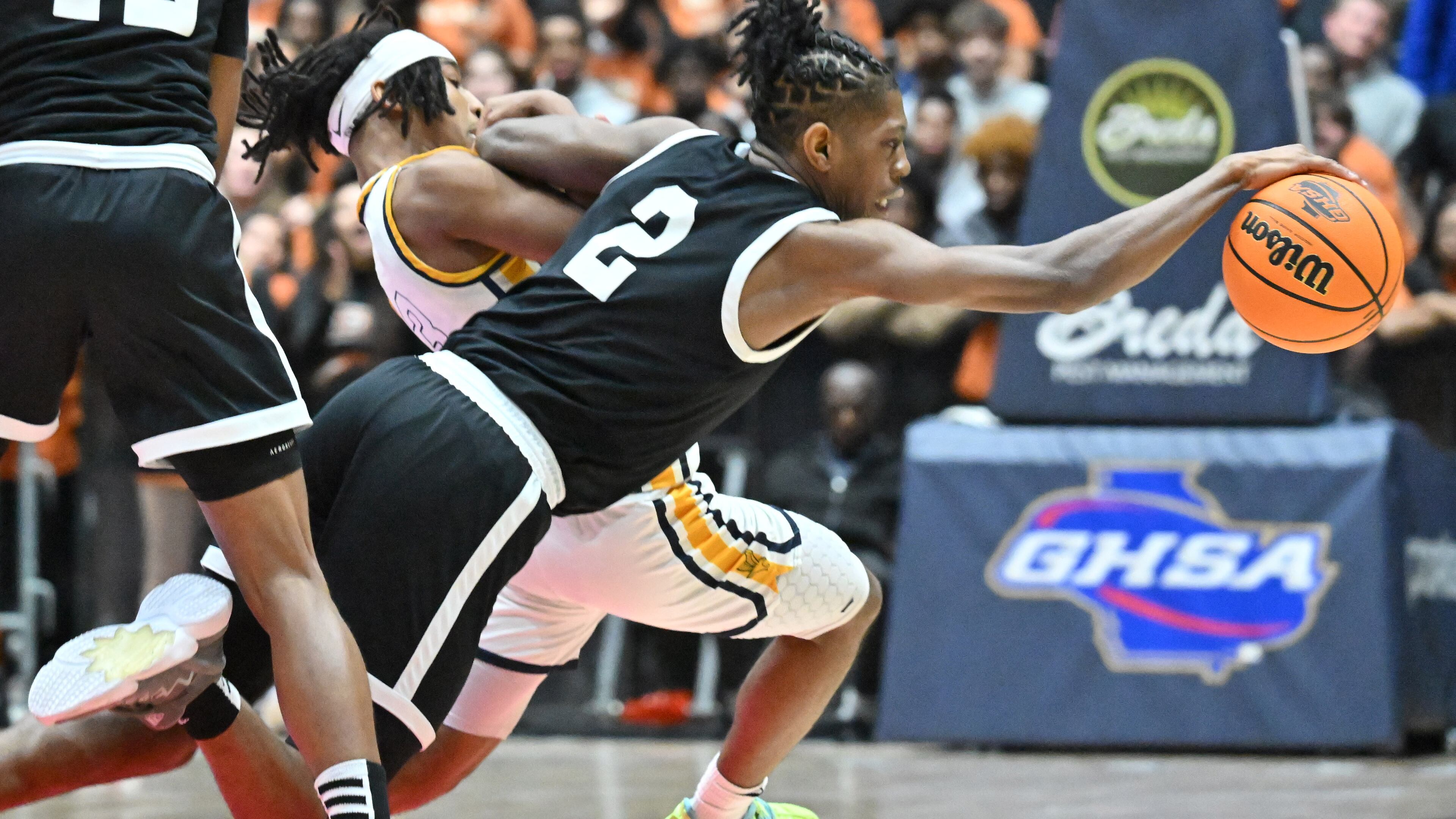 Kell’s Parrish Johnson Jr. (2) and Eagle's Landing Clark Masten (left) collide as they fight for a loose ball during 2023 GHSA Basketball Class 5A Boy’s State Championship game at the Macon Centreplex, Thursday, March 9, 2023, in Macon, GA. (Hyosub Shin / Hyosub.Shin@ajc.com)