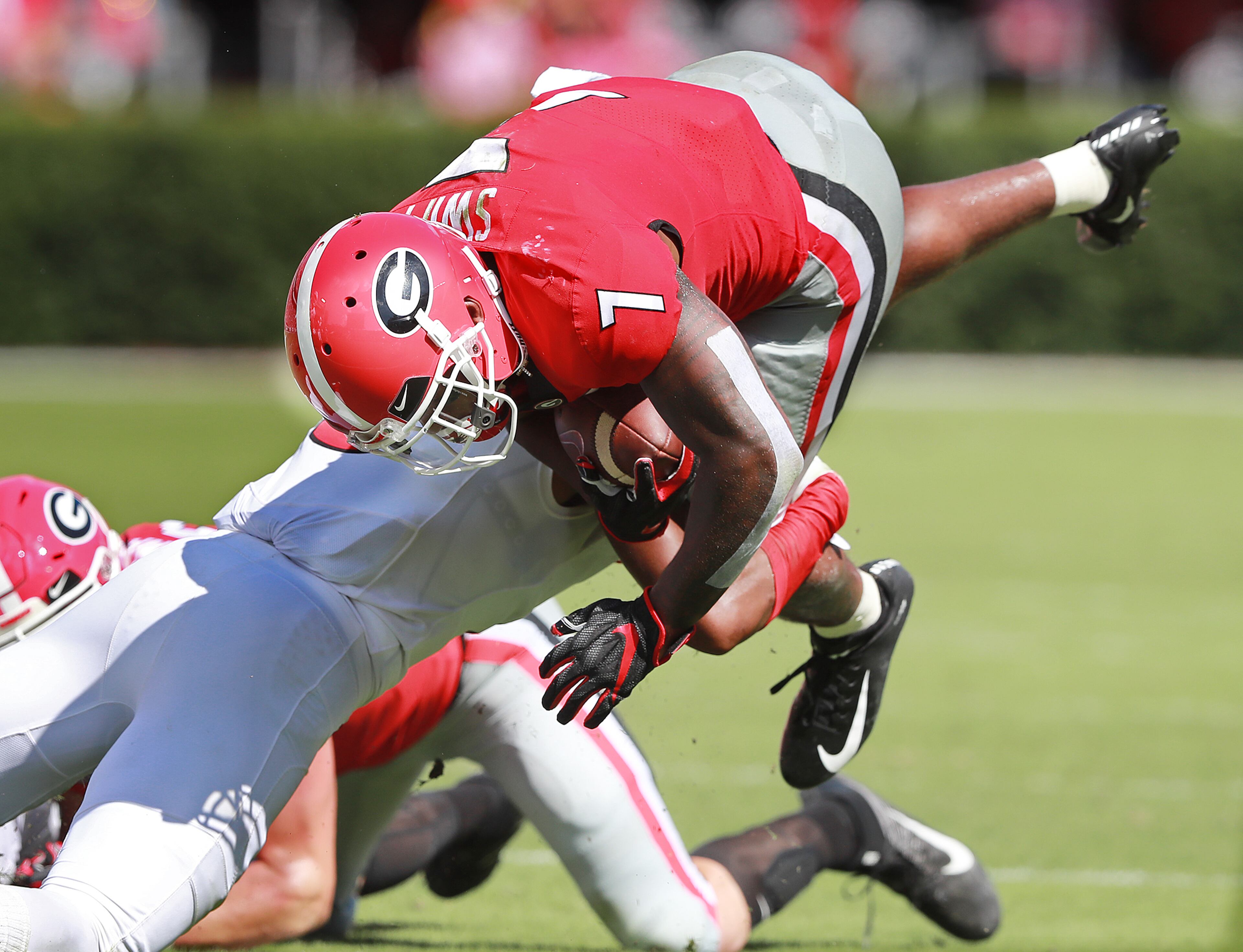 September 1, 2018 Athens: Georgia Bulldogs running back DeAndre Swift goes over the top of Austin Peay defenders for a first down during the first half in a NCAA college football game on Saturday, Sept 1, 2018, in Athens. Curtis Compton/ccompton@ajc.com