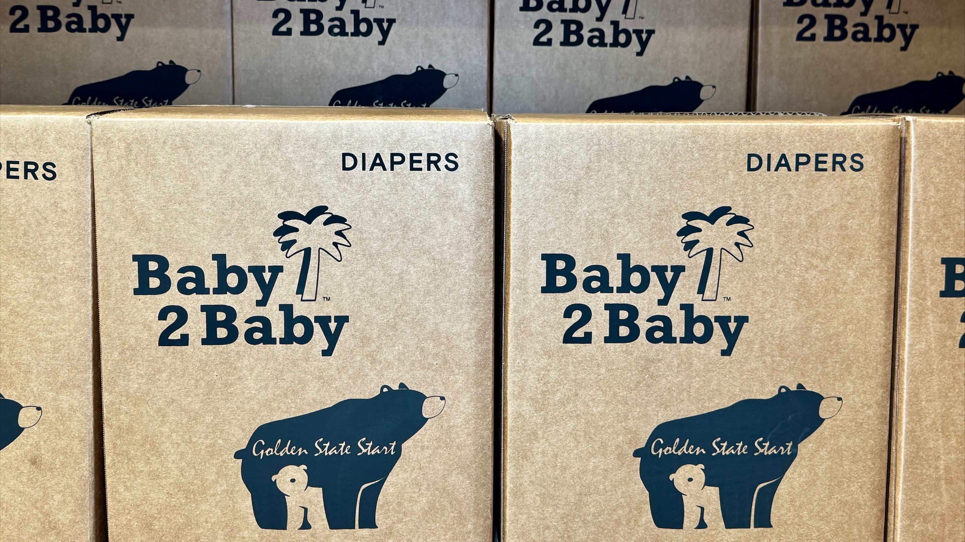 This photo provided by Baby2Baby shows stacks of packaged diapers Wednesday, May 7, 2026, at Baby2Baby's Los Angeles headquarters. (Baby2Baby via AP)