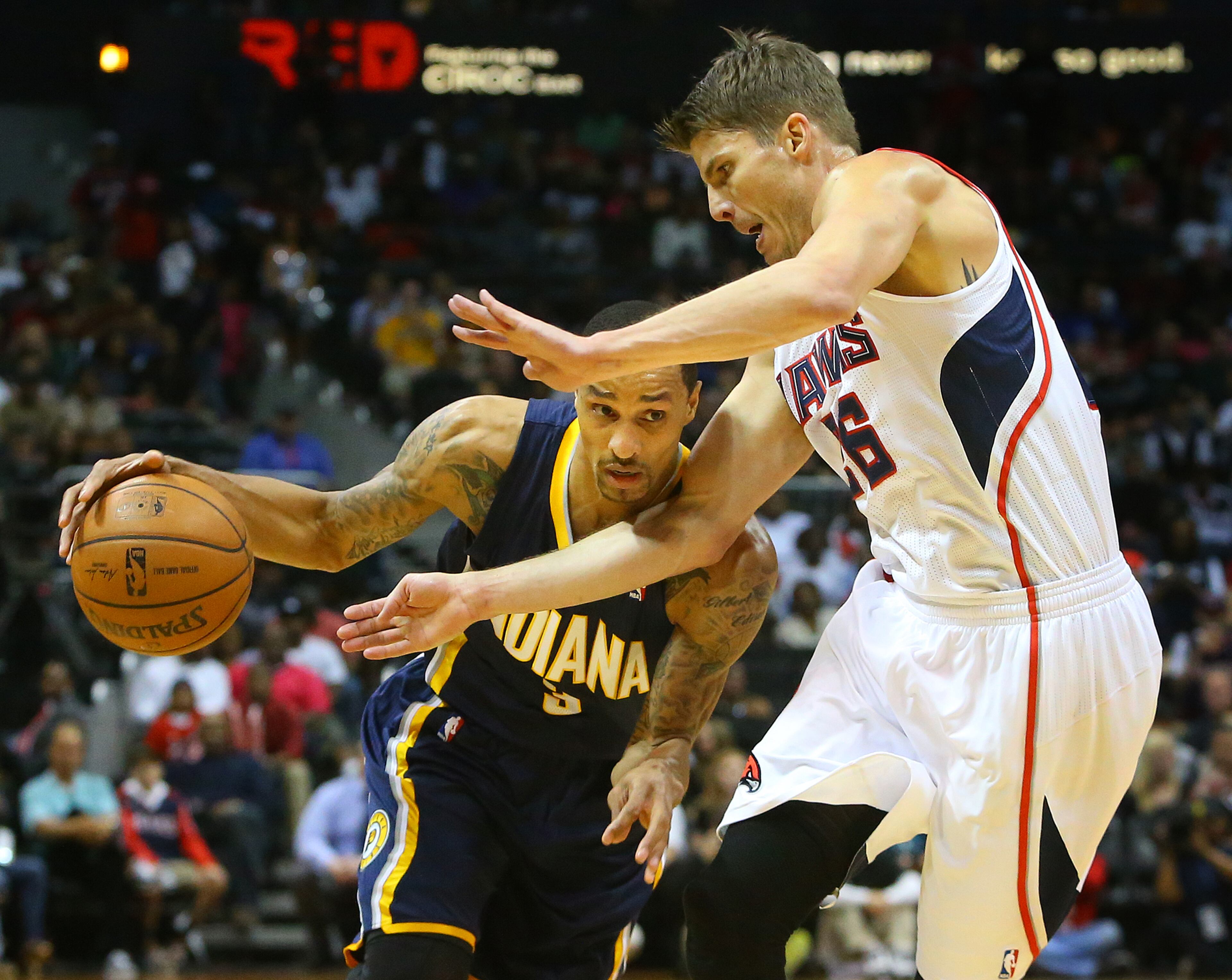 Hawks Kyle Korver defends against Pacers George Hill as he tries to drive to the basket during the first half of their NBA playoff game on Thursday, April 24, 2014, in Atlanta. CURTIS COMPTON / CCOMPTON@AJC.COM