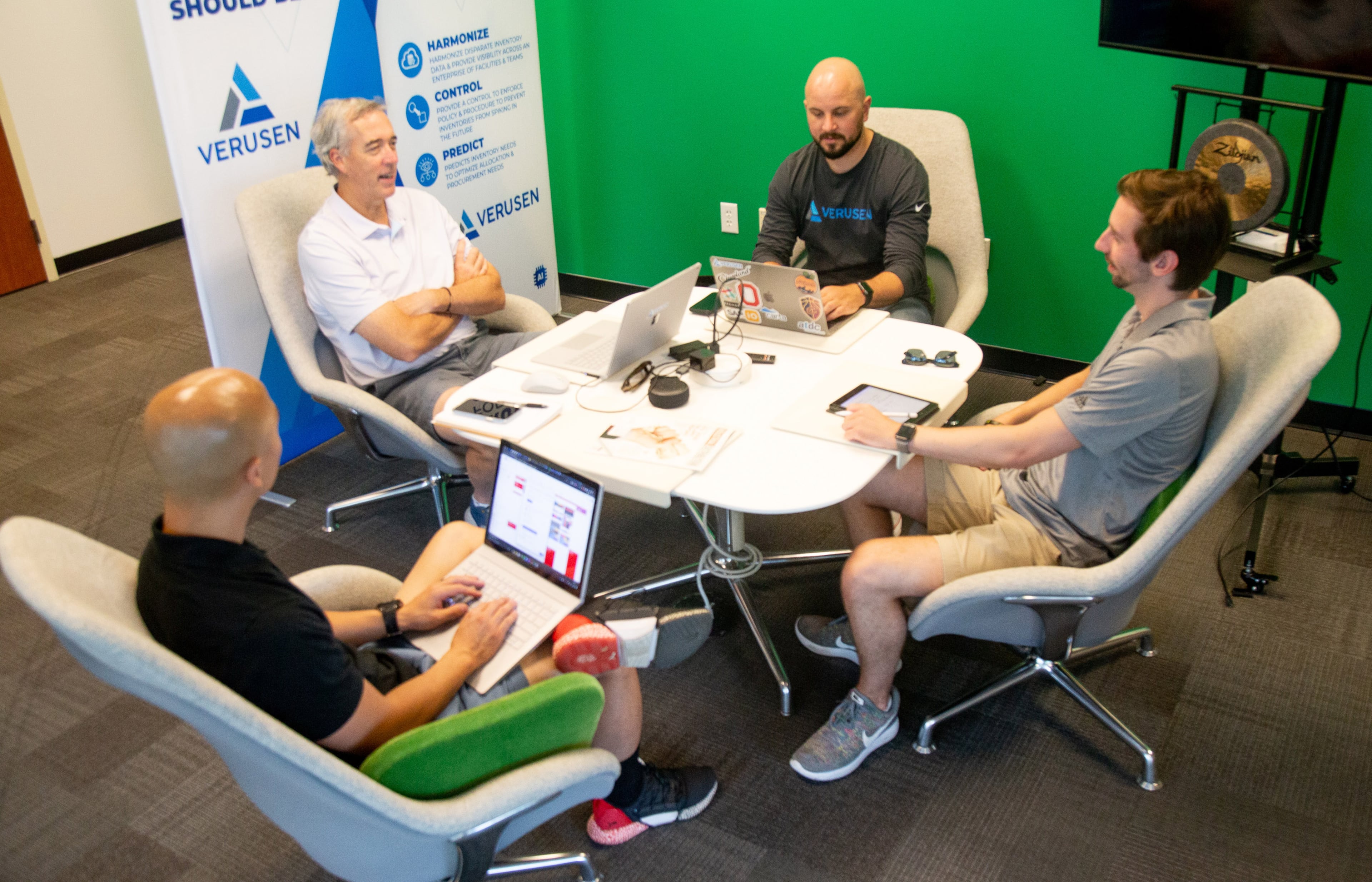 Paul Noble, (center) the founder of Verusen, an Atlanta logistics firm, talks with employees during an afternoon meeting at their Atlanta headquarters. The company helped Georgia-Pacific's paper towel division catch up to demand. STEVE SCHAEFER / SPECIAL TO THE AJC