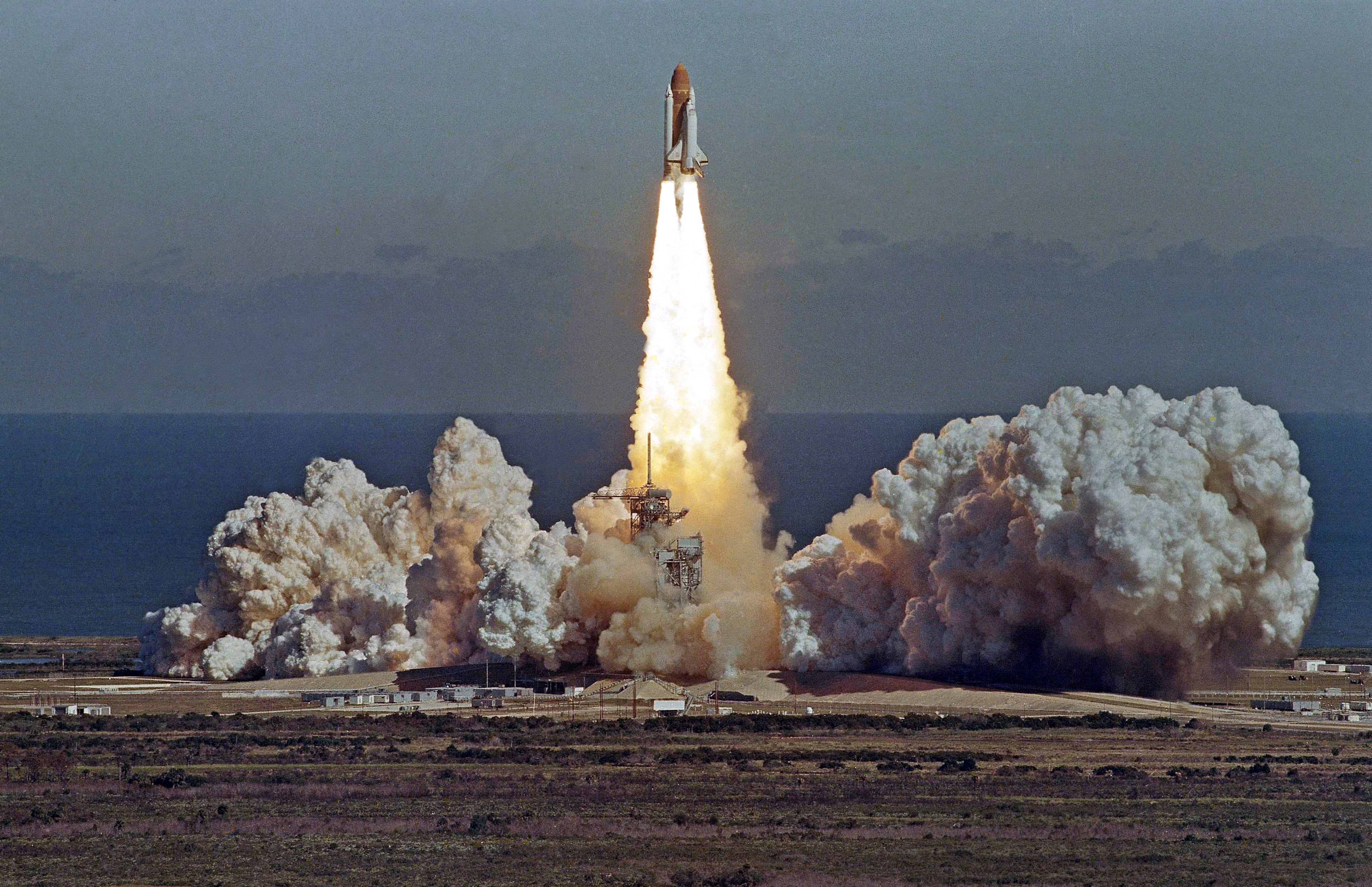 In this Jan. 28, 1986 picture, the space shuttle Challenger lifts off from the Kennedy Space Center in Cape Canaveral, Fla. shortly before it exploded with a crew of seven aboard. (AP Photo/Thom Baur)