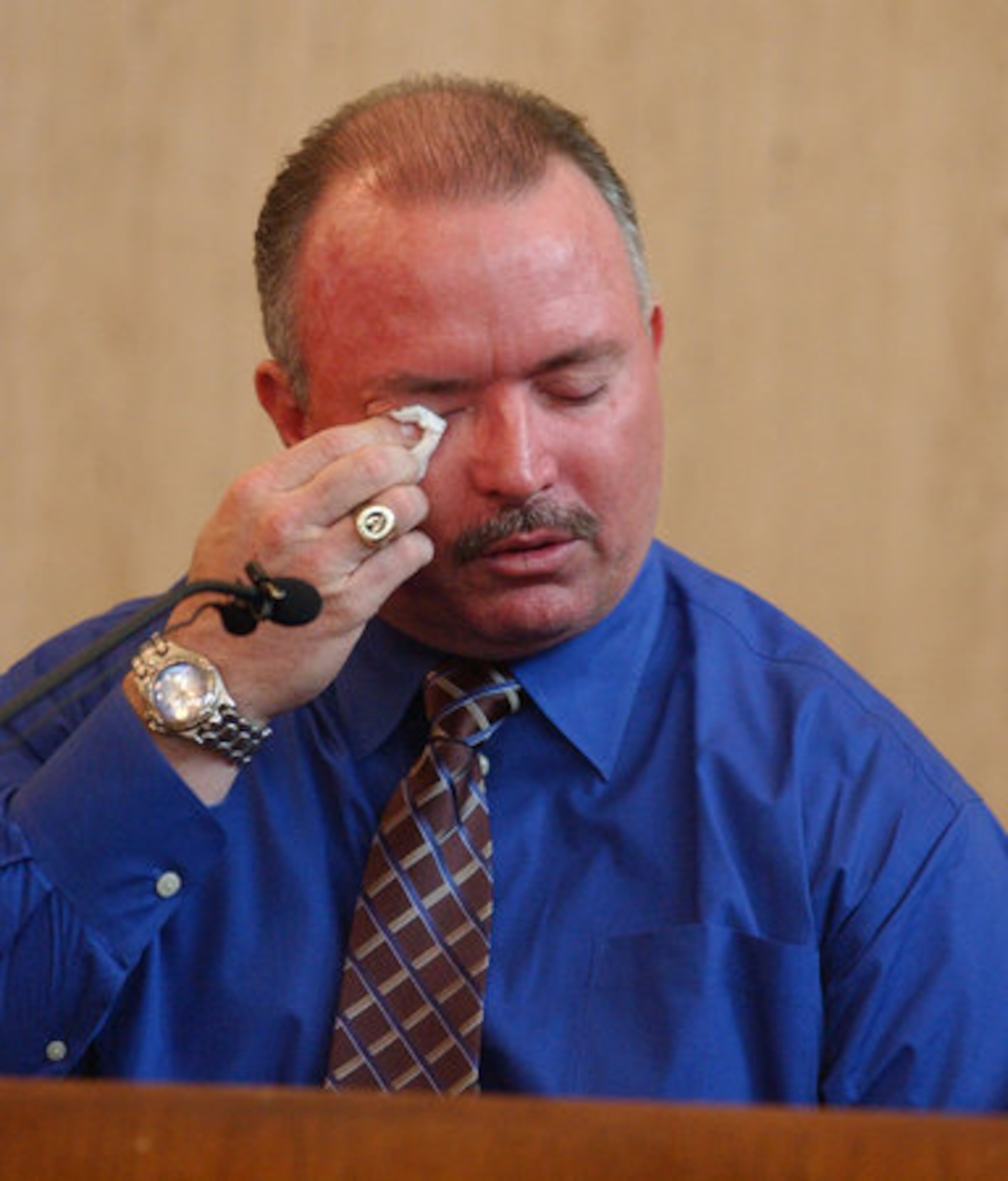 In this March 2007 photo, David Dunkerton wiped away tears as he described Glenn Turner's funeral while giving testimony on the opening day of the murder trial of Lynn Turner for the death of her live-in boyfriend Randy Thompson. Dunkerton and Turner had been partners on motorcycle patrol in Cobb County.