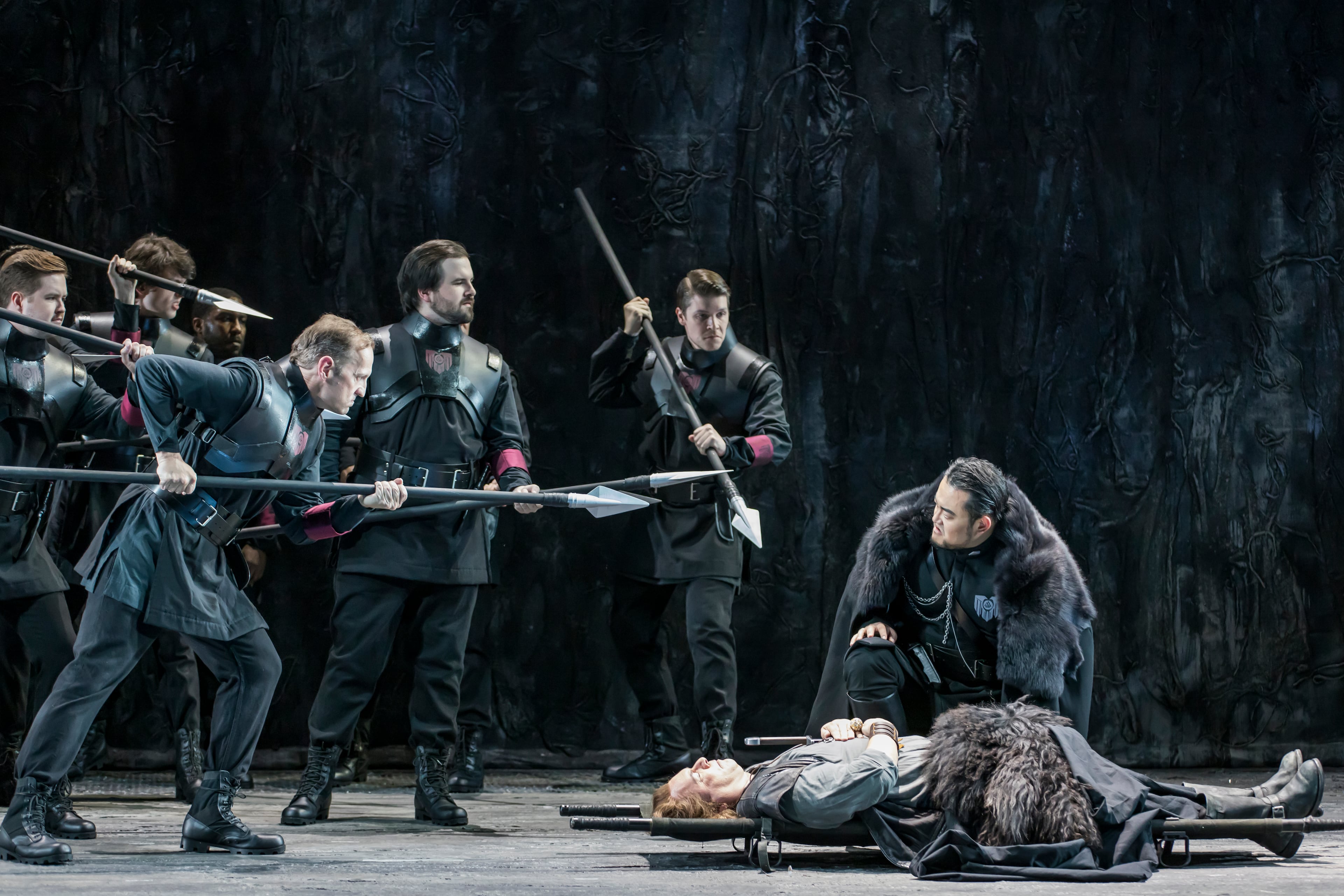 Le Bu as Gunther leans over the stretchered Siegfried, sung by Stefan Vink. (Raftermen/Courtesy of Atlanta Opera)