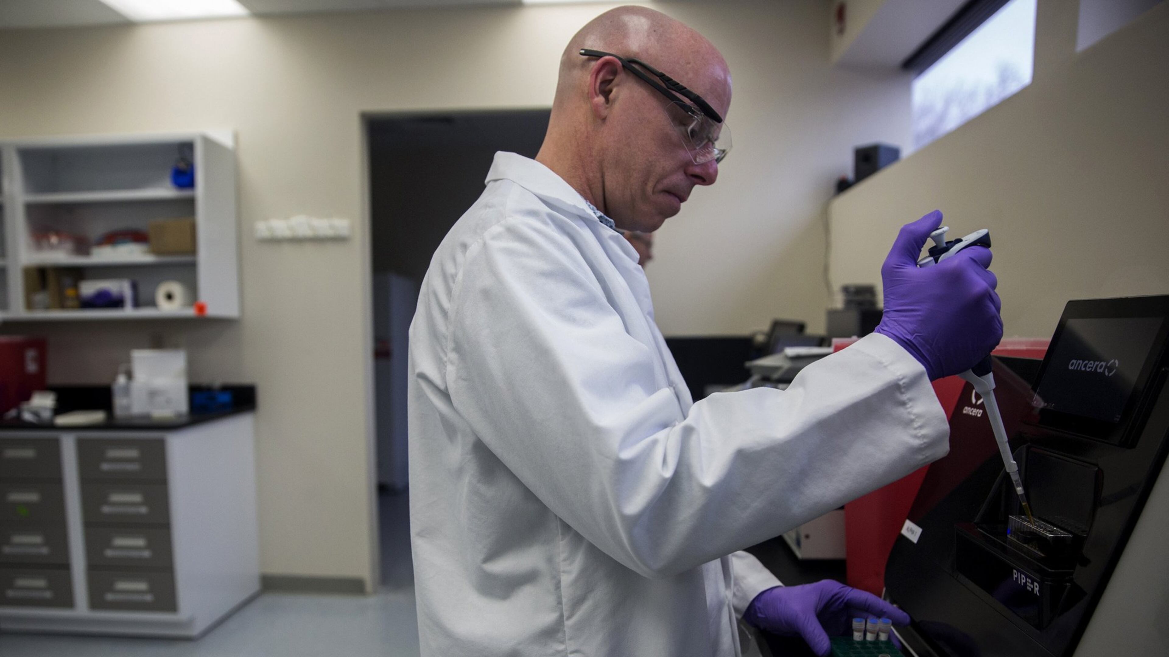 Ancera Software Engineer Gary Root prepares to run an assay on their platform. Ancera is a startup in Branford that has created a machine that can detect and count bacteria in food. This machine will first be sold and used in poultry slaughterhouses for quicker testing of bacterias like salmonella, listeria and other contaminants. (Lauren Schneiderman/Hartford Courant/TNS)