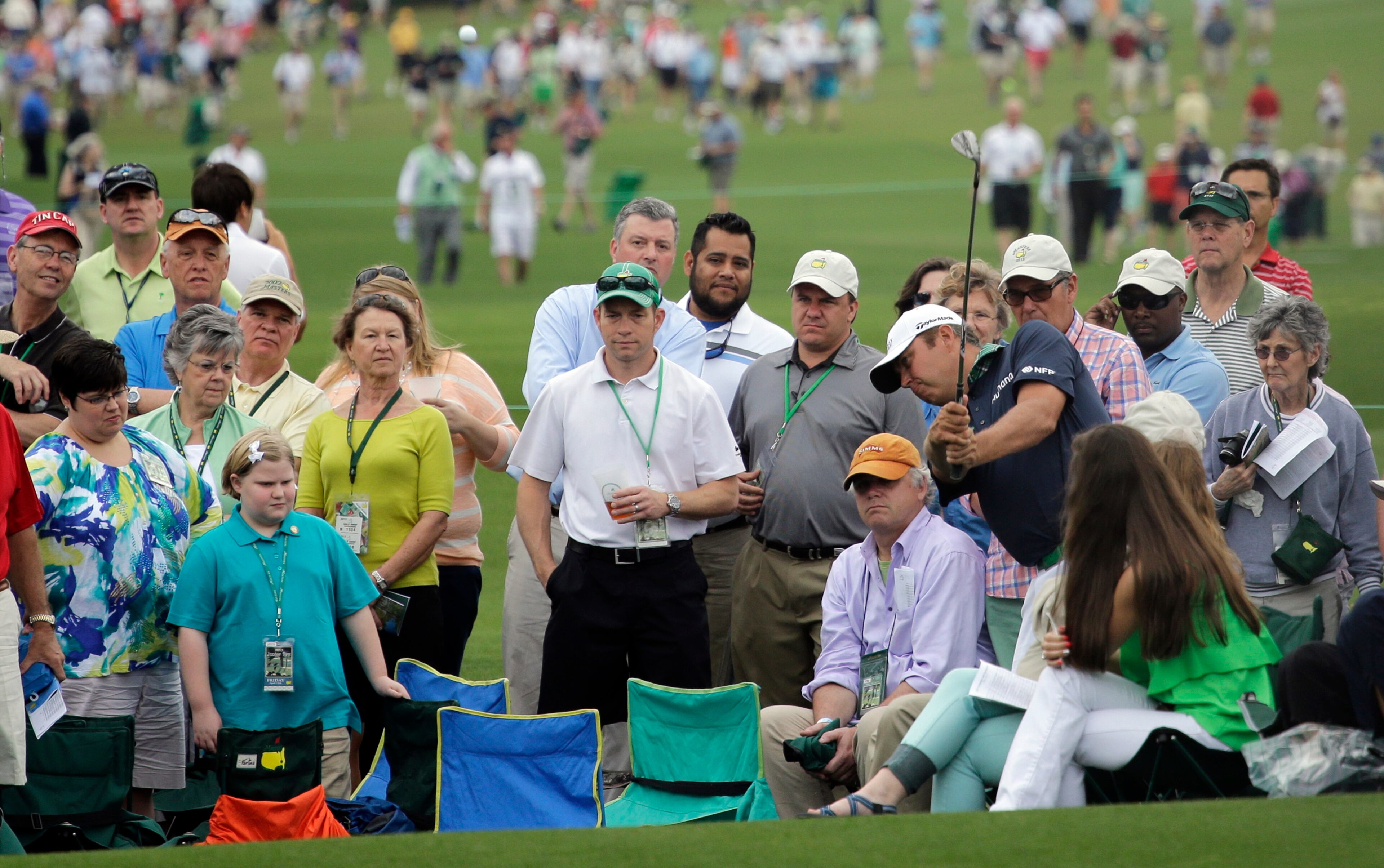 Bo Van Pelt hits from inside the gallery on the second hole during the second round of the Masters golf tournament Friday, April 12, 2013, in Augusta, Ga.