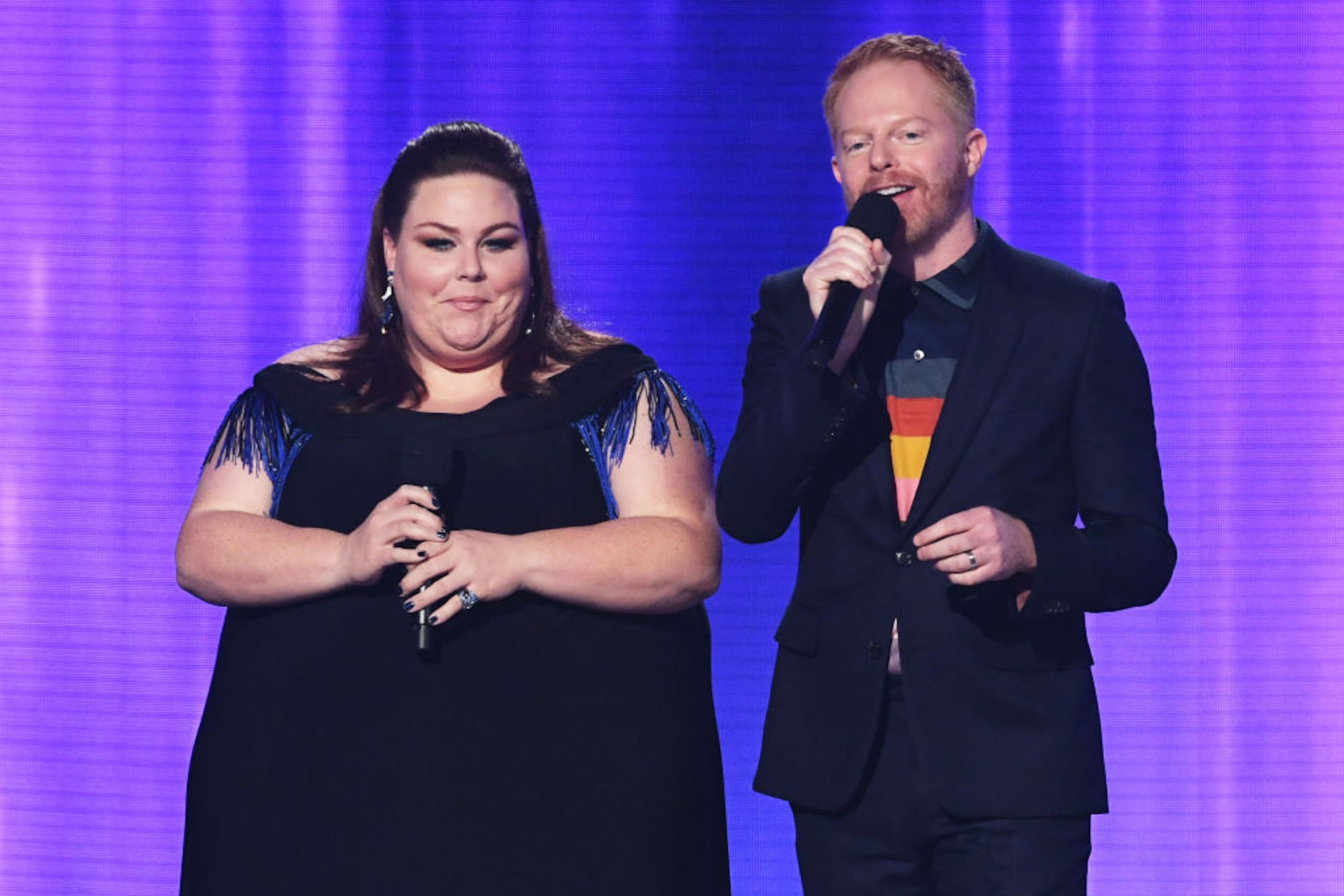 LOS ANGELES, CA - NOVEMBER 19: Chrissy Metz (L) and Jesse Tyler Ferguson speak onstage during the 2017 American Music Awards at Microsoft Theater on November 19, 2017 in Los Angeles, California. (Photo by Kevin Winter/Getty Images)