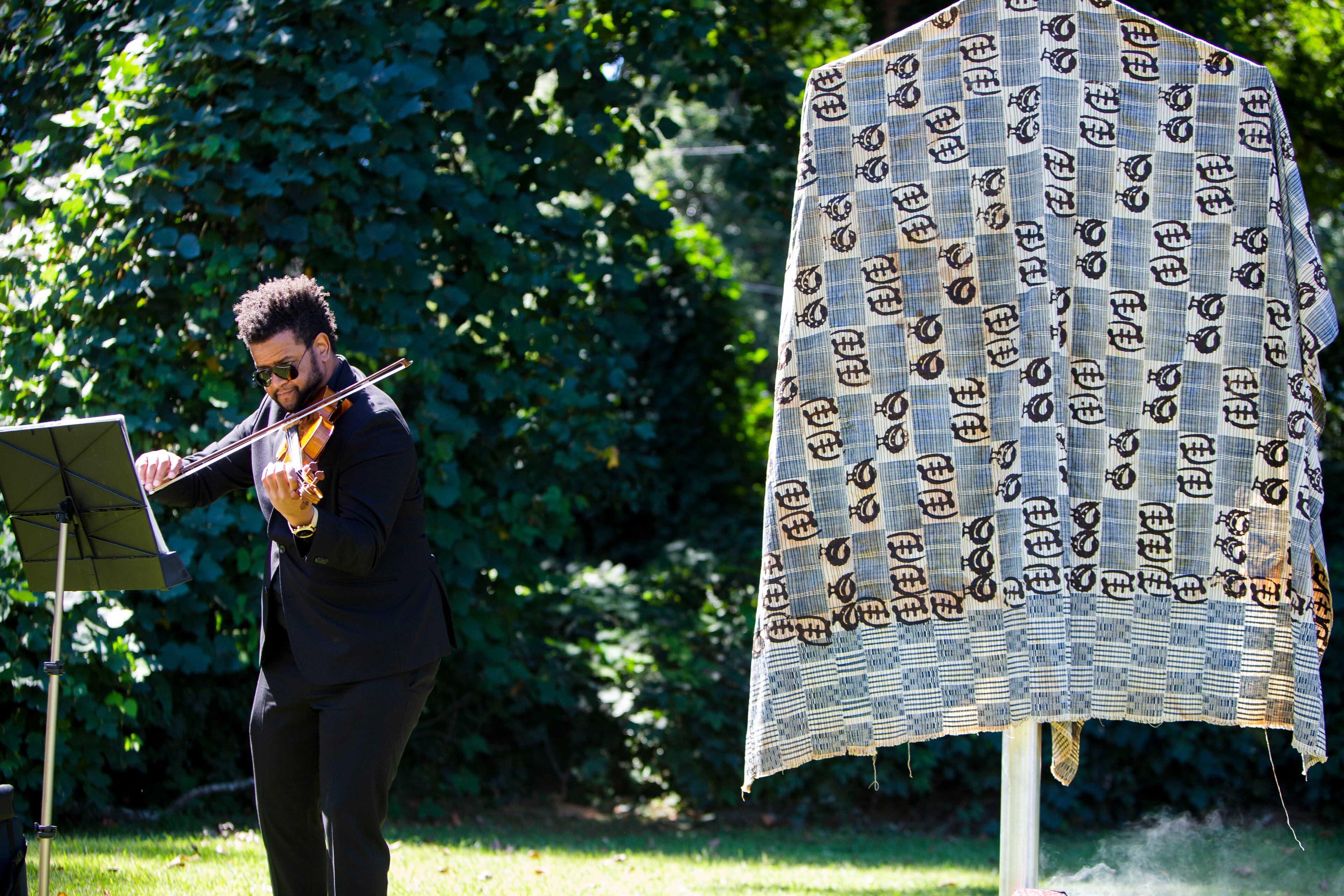 Christopher Mosley plays the violin during the dedication of a historical marker for Zeb Long, a lynching victim from the 1906 Atlanta Race Massacre, on Saturday, September 24, 2022, at Sumner Park in East Point. CHRISTINA MATACOTTA FOR THE ATLANTA JOURNAL-CONSTITUTION