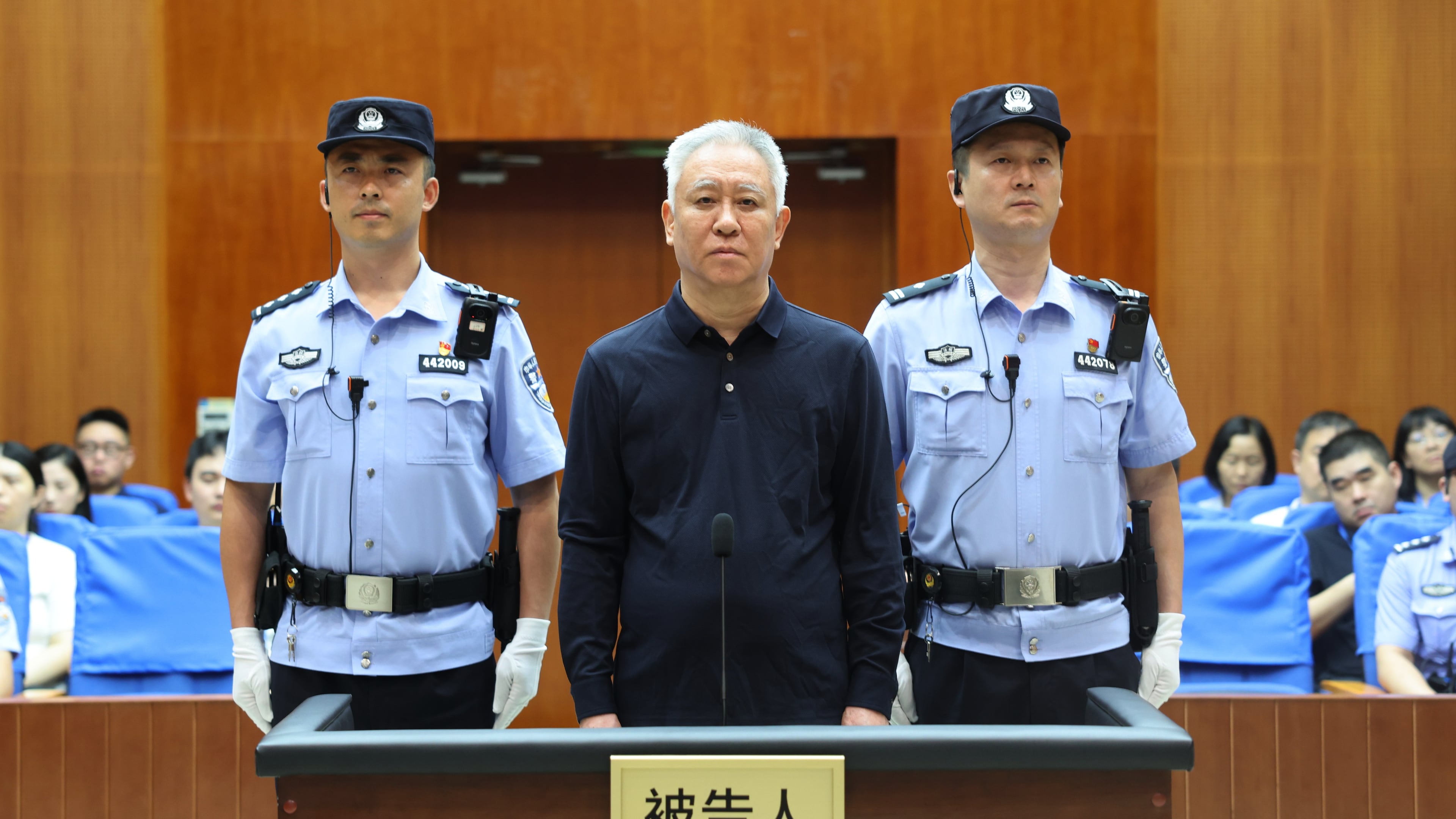 In this handout photo released by Xinhua News Agency, Hui Ka Yan, also known as Xu Jiayin, founder of property developer Evergrande stands trial at the Shenzhen Intermediate People's Court in Shenzhen, south China's Guangdong Province, Thursday, Aug. 20, 2026. (Shenzhen Intermediate People's Court/Xinhua via AP)
