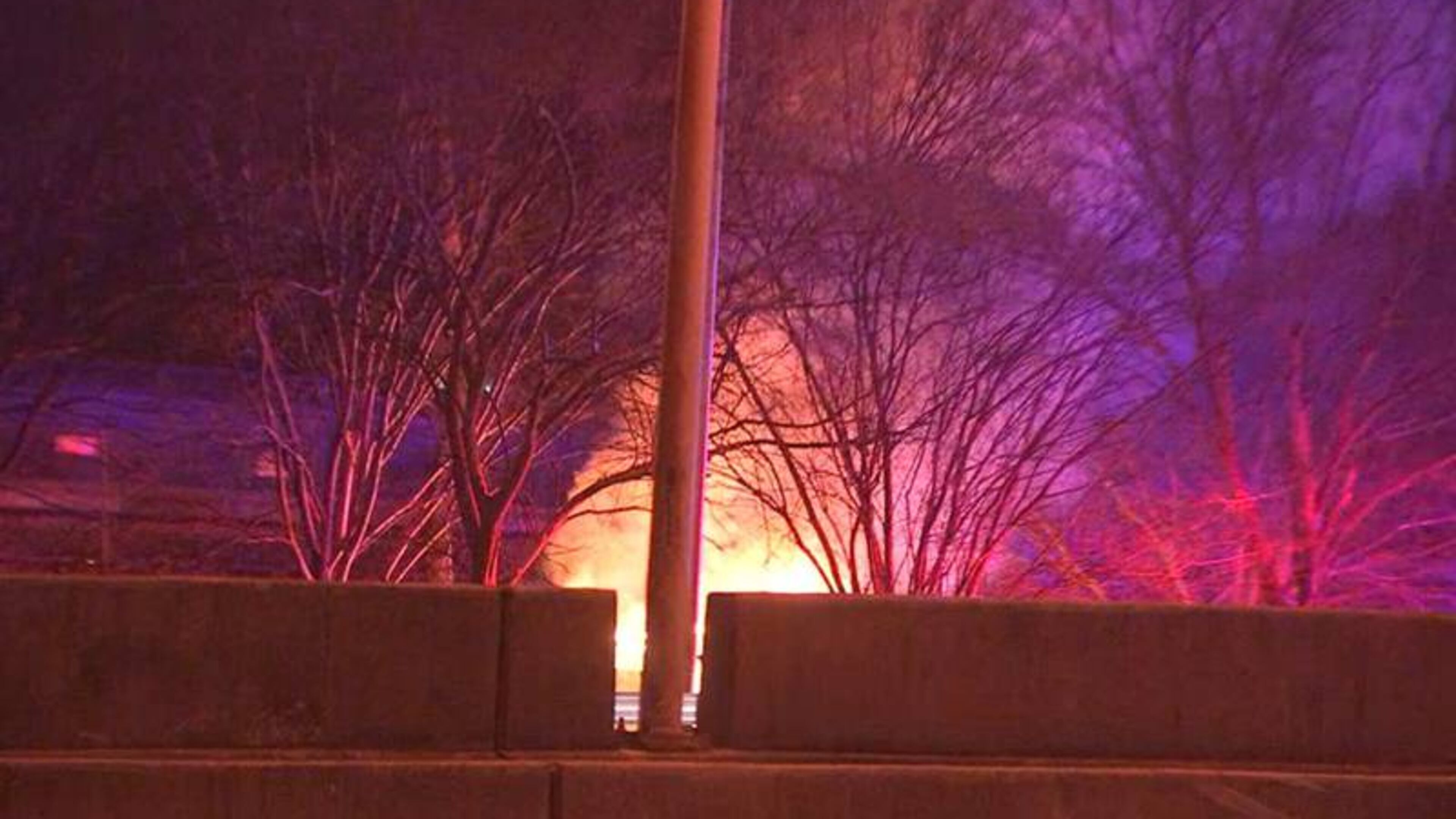 A Chrysler 200 being pursued by Georgia State Patrol troopers burst into flames Friday morning after it hit a light pole and a tree on the Buford Spring Connector, authorities said.