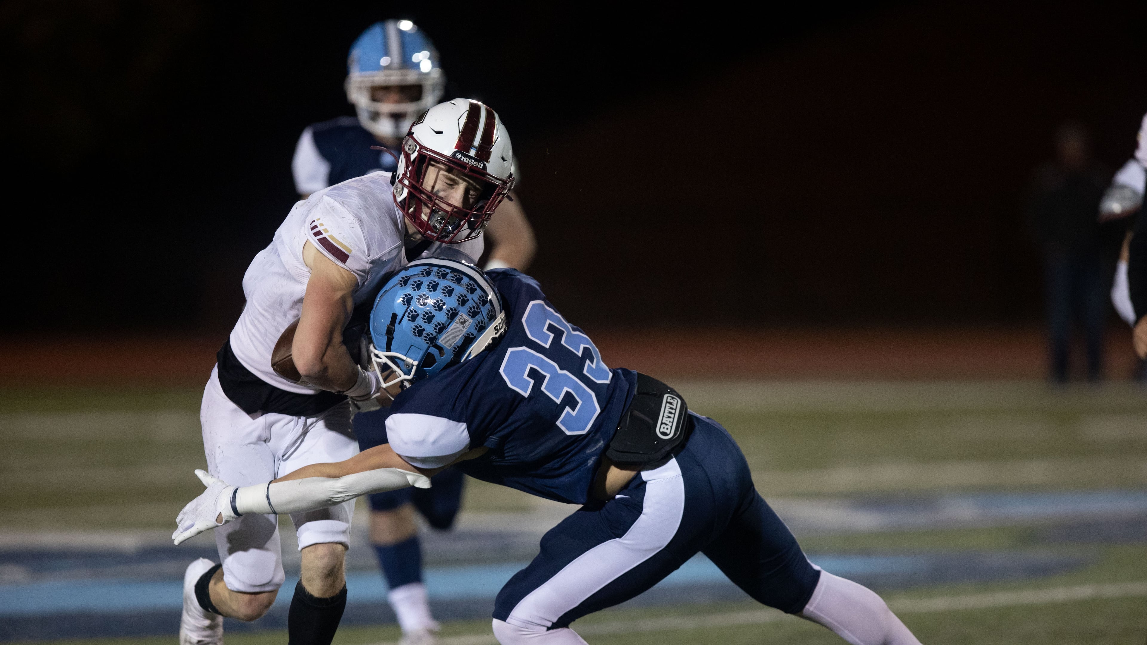 South Paulding's Alex Watkins (7) is tackled by Ben Ridenour (33) during a GHSA high school football game between Cambridge and South Paulding at Cambridge High School in Milton, GA., on Saturday, November 13, 2021. (Photo/Jenn Finch)