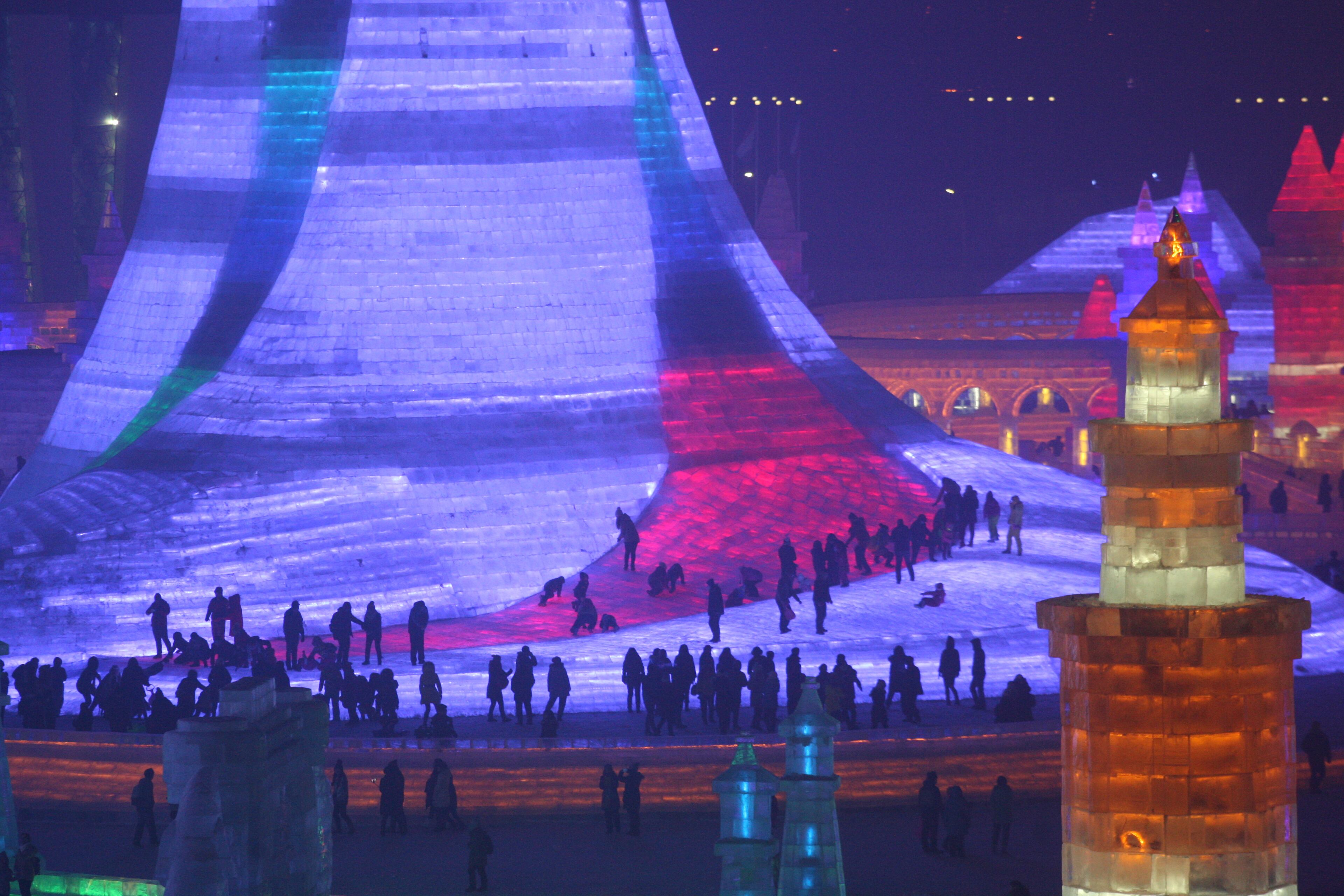 HARBIN, CHINA - DECEMBER 22: (CHINA OUT) Tourists visit the 17th Harbin Ice And Snow World during its test run on December 22, 2015 in Harbin, China. The event will run from December 25, 2015 to February 25, 2016. (Photo by ChinaFotoPress/ChinaFotoPress via Getty Images)