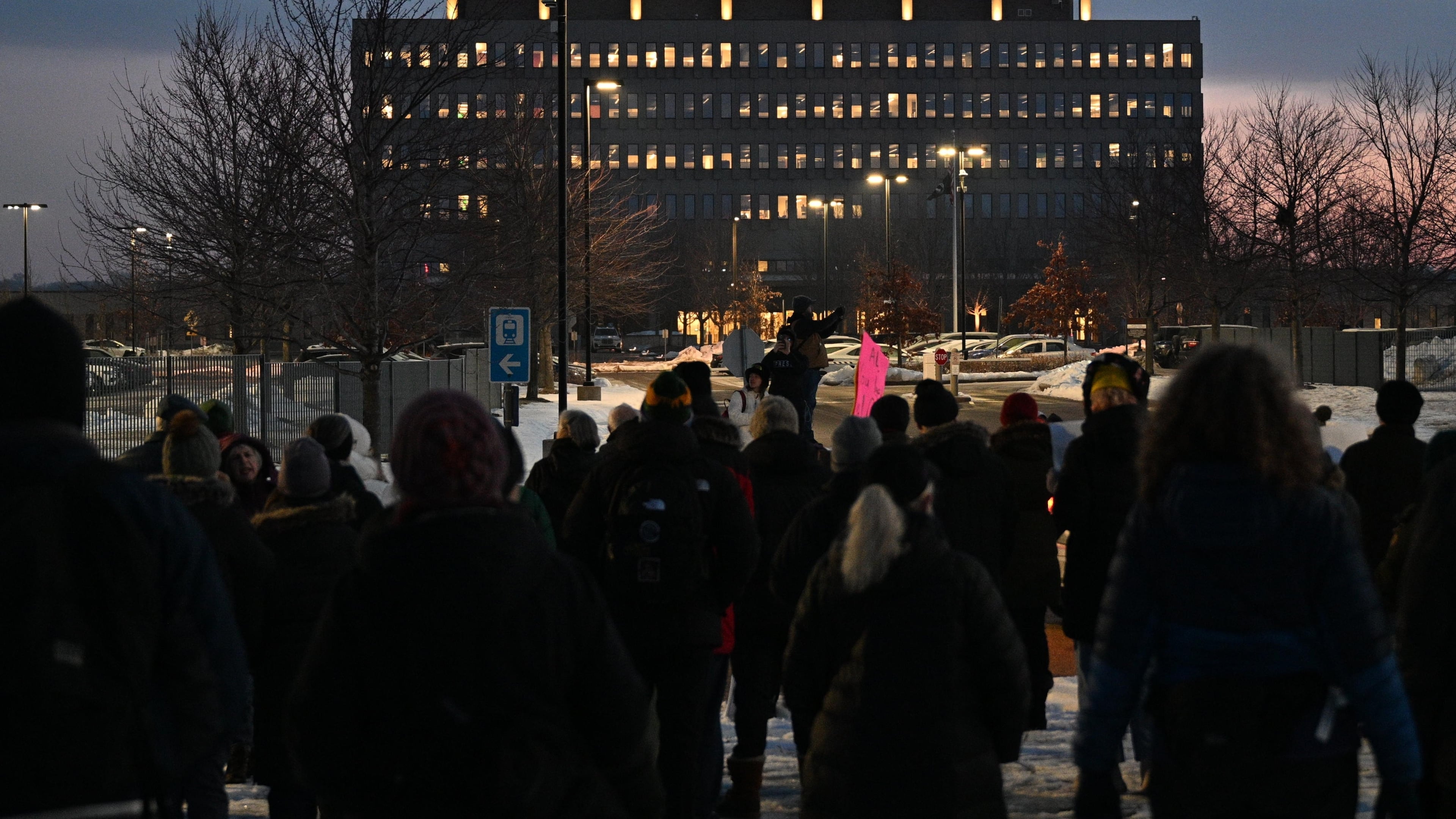 FILE - Protesters gather outside the Bishop Henry Whipple Federal Building, Jan. 8, 2026, in Minneapolis, Minn. (AP Photo/Tom Baker, File)