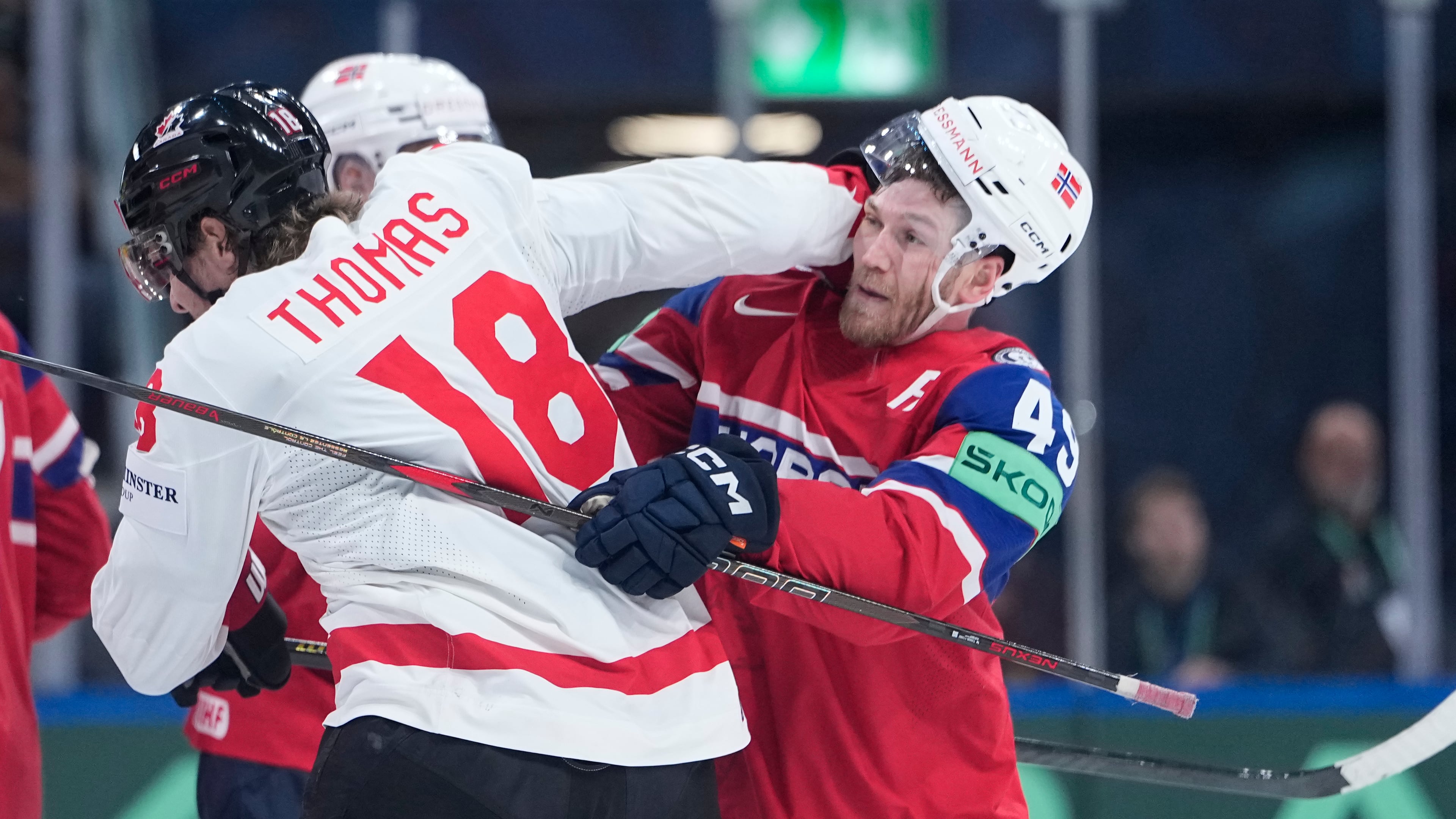 Canada's Robert Thomas (18) clashes with Norway's Christian Kaasastul (49) during the 2026 IIHF Men's Ice Hockey World Championship bronze medal match between Canada and Norway, in Zurich, Switzerland, Sunday, May 31, 2026. (AP Photo/Darko Bandic)