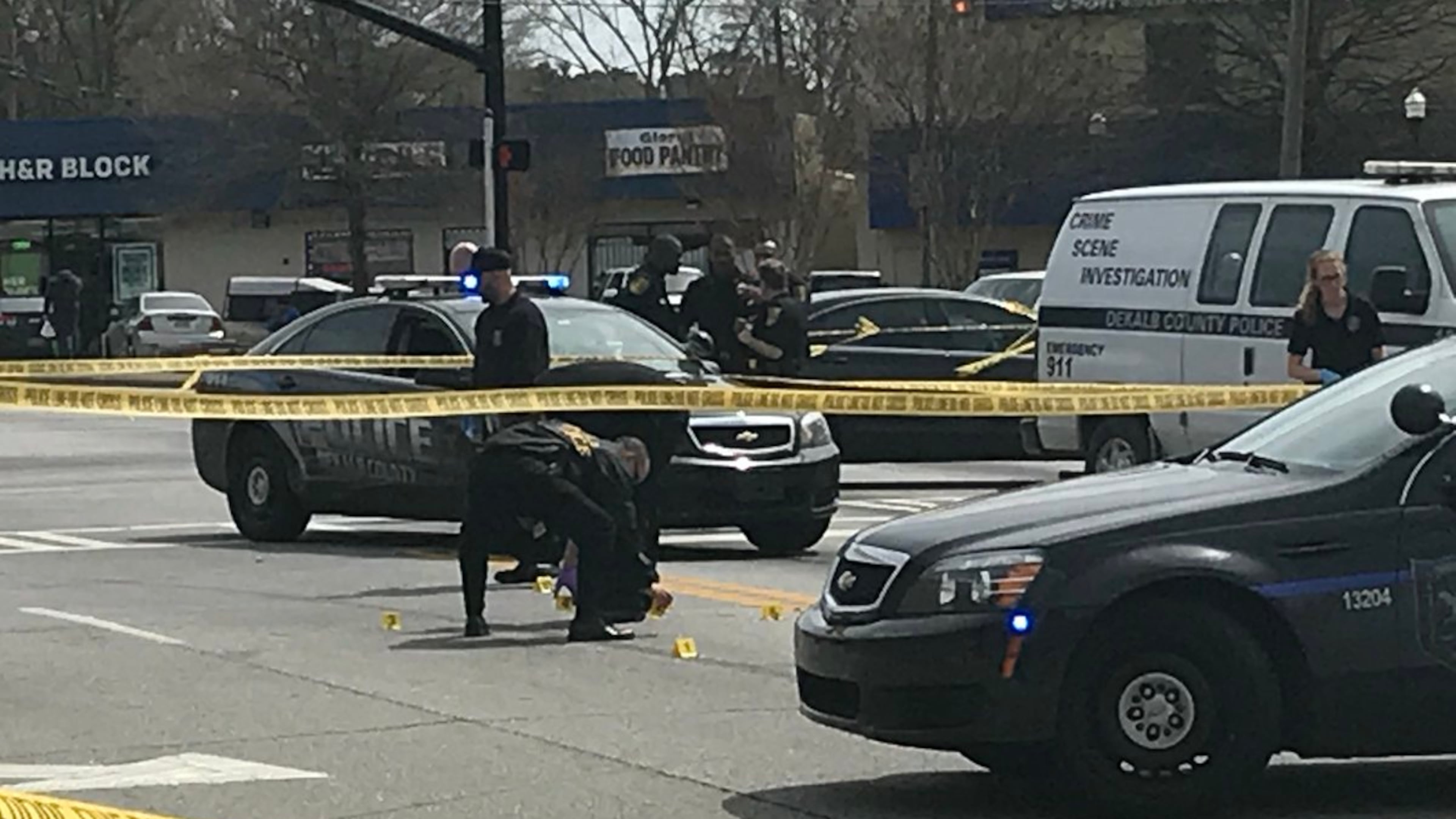 DeKalb County police check evidence after a deadly shooting.