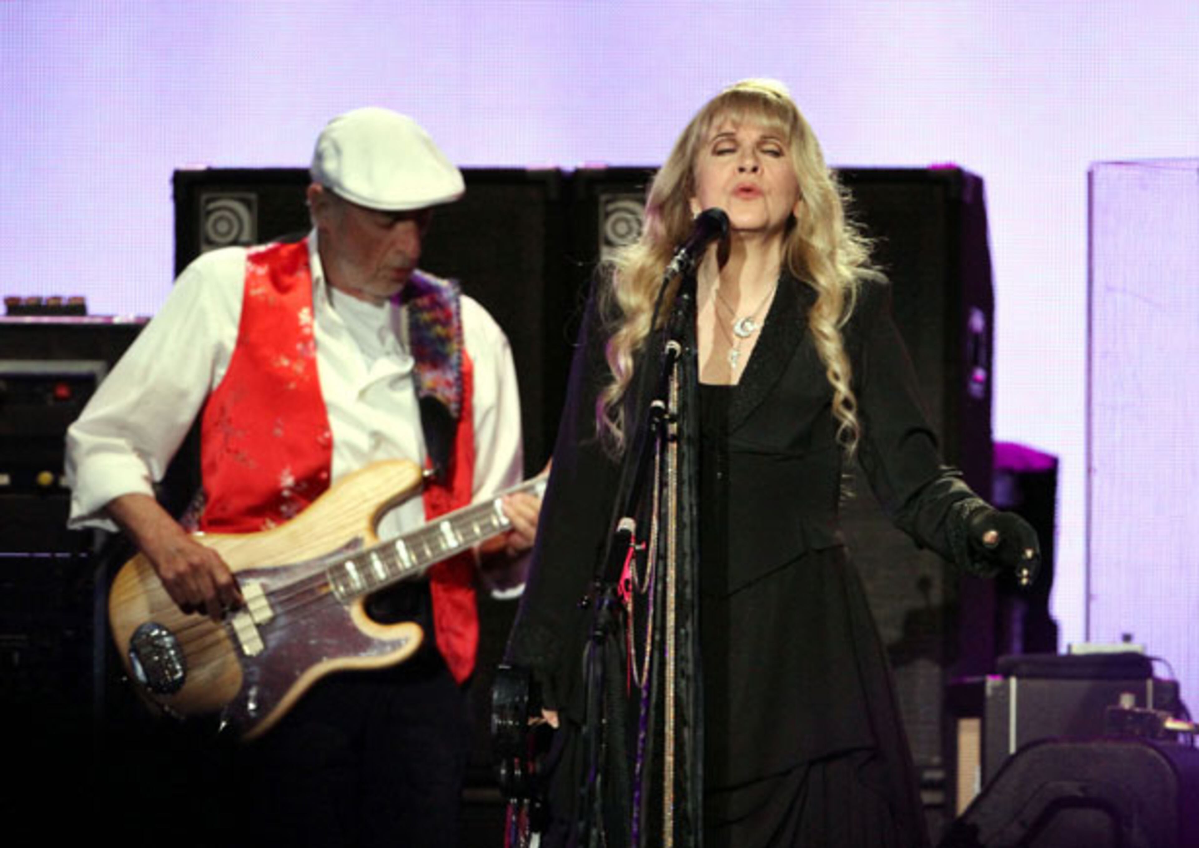 John McVie and Stevie Nicks perform during Fleetwood Mac's On With the Show tour stop at a sold-out Philips Arena in Atlanta Wednesday, Dec. 17, 2014. The tour marks the first time in 16 years that Stevie Nicks, Mick Fleetwood, Lindsey Buckingham and John McVie have toured with Christine McVie. Robb D. Cohen/RobbsPhotos.com