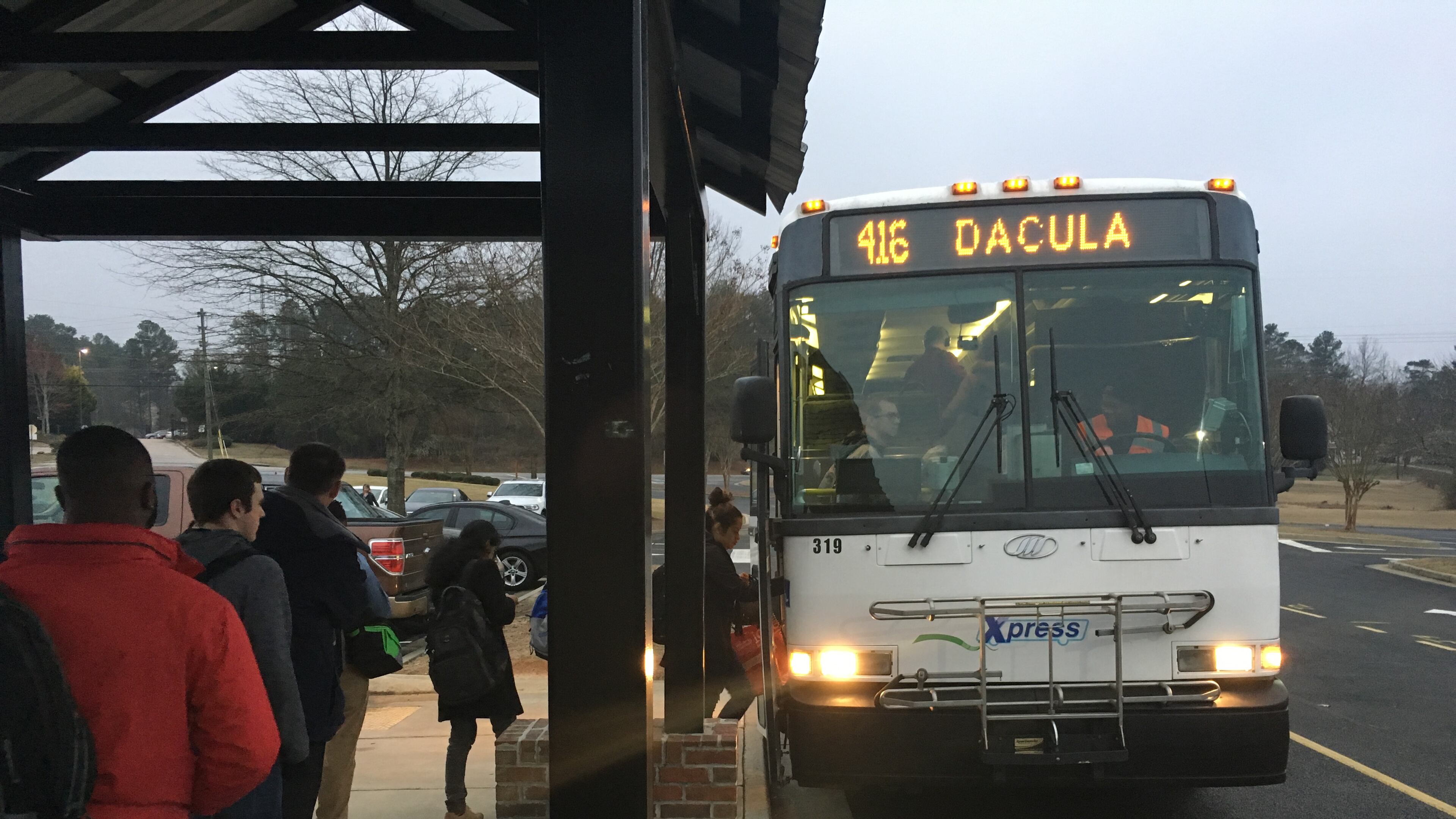 In this 2017 file photo, riders board an Xpress bus in Dacula. TYLER ESTEP / TYLER.ESTEP@AJC.COM