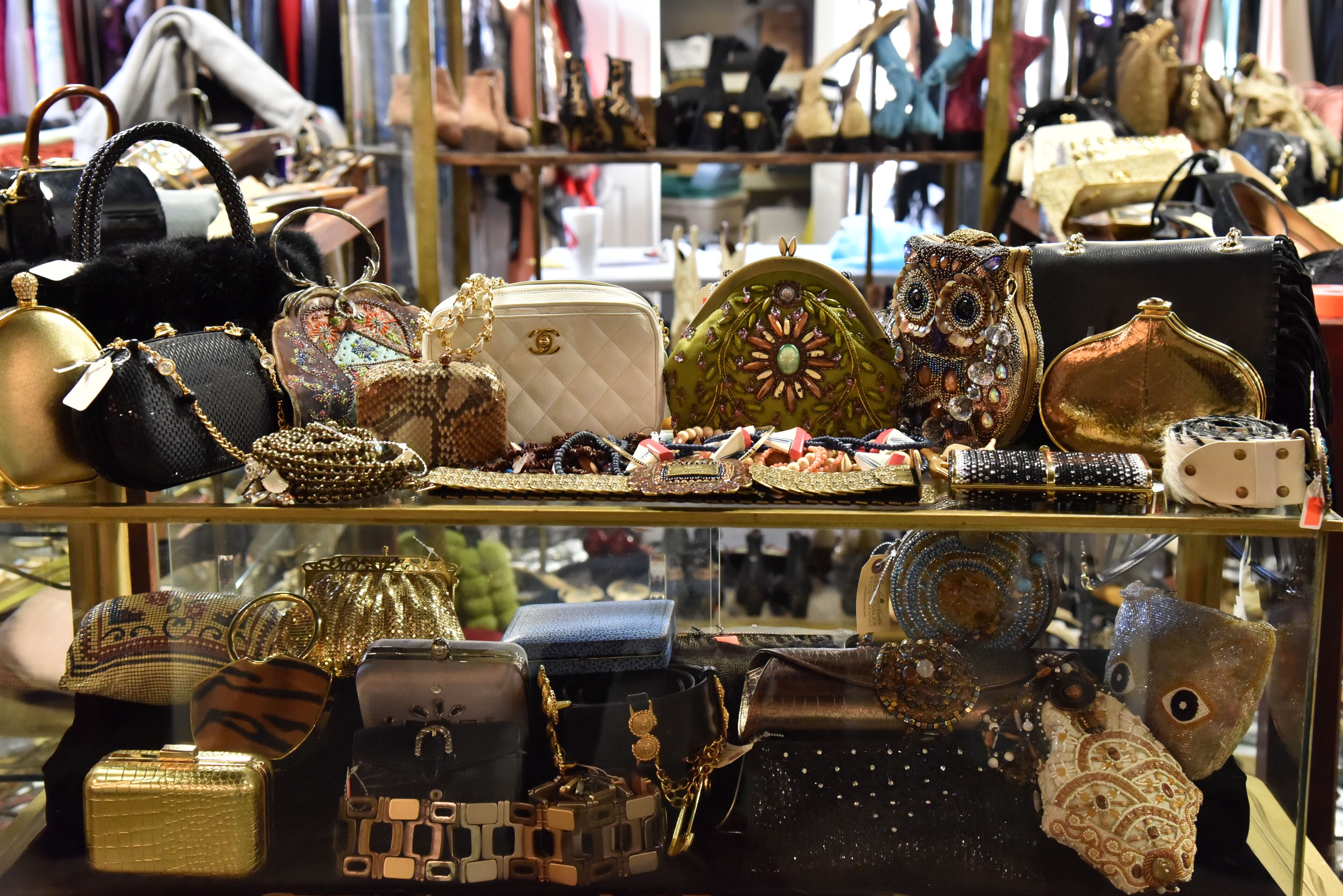 More than 2,000 items that belonged to the late Diane McIver are in a warehouse showroom of Peachtree Battle Estate Sales and Liquidations, being prepared for the estate sale that runs December 7-10. Tex McIver has enlisted an estate liquidation company to sell his deceased wife's clothing and jewelry items. HYOSUB SHIN / HSHIN@AJC.COM