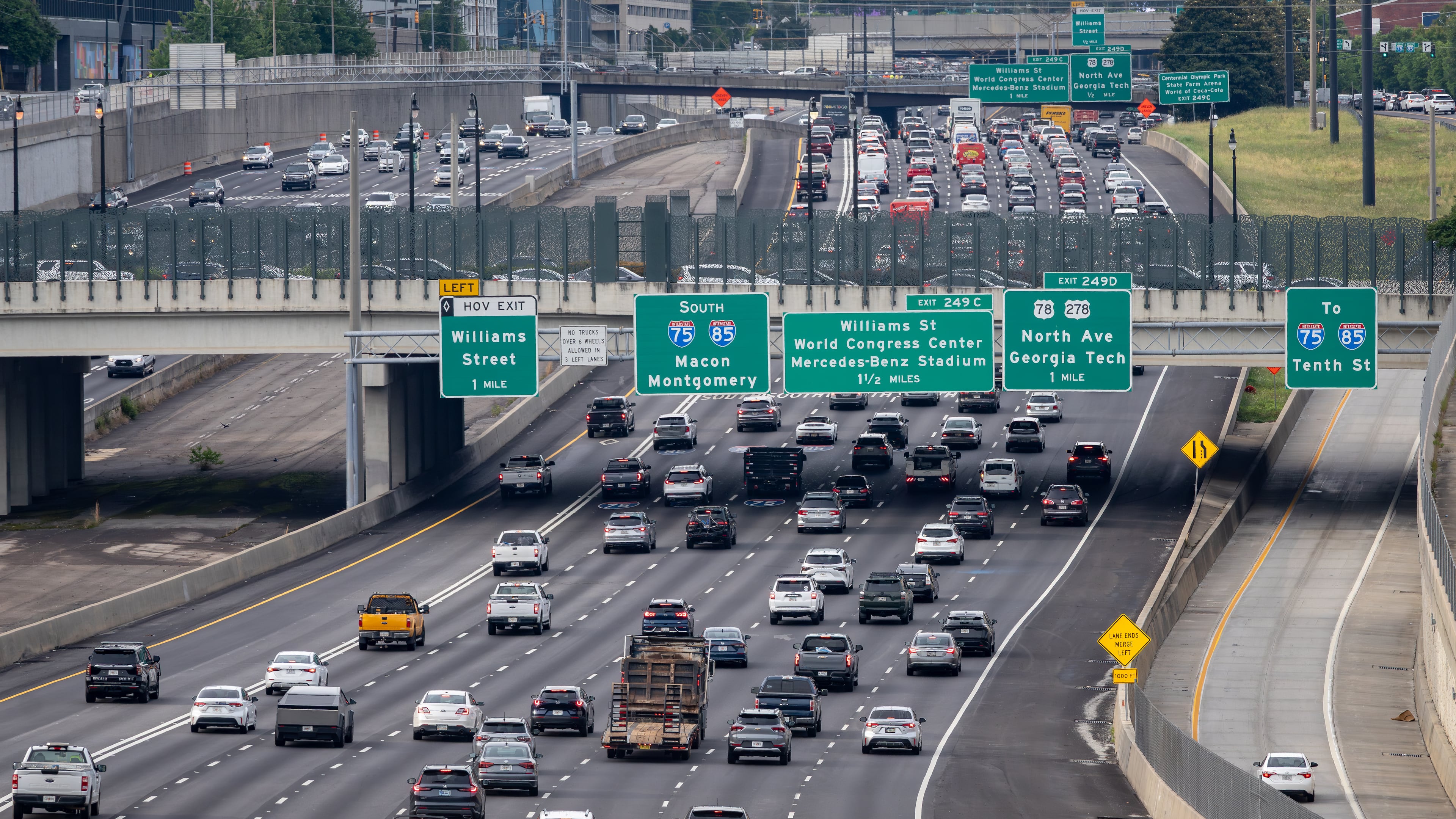 Cars make their way along the Downtown Connector in Atlanta. Auto insurance is one of the largest recurring costs associated with vehicle ownership, McKynzie Steward writes. (Ben Hendren for the AJC)